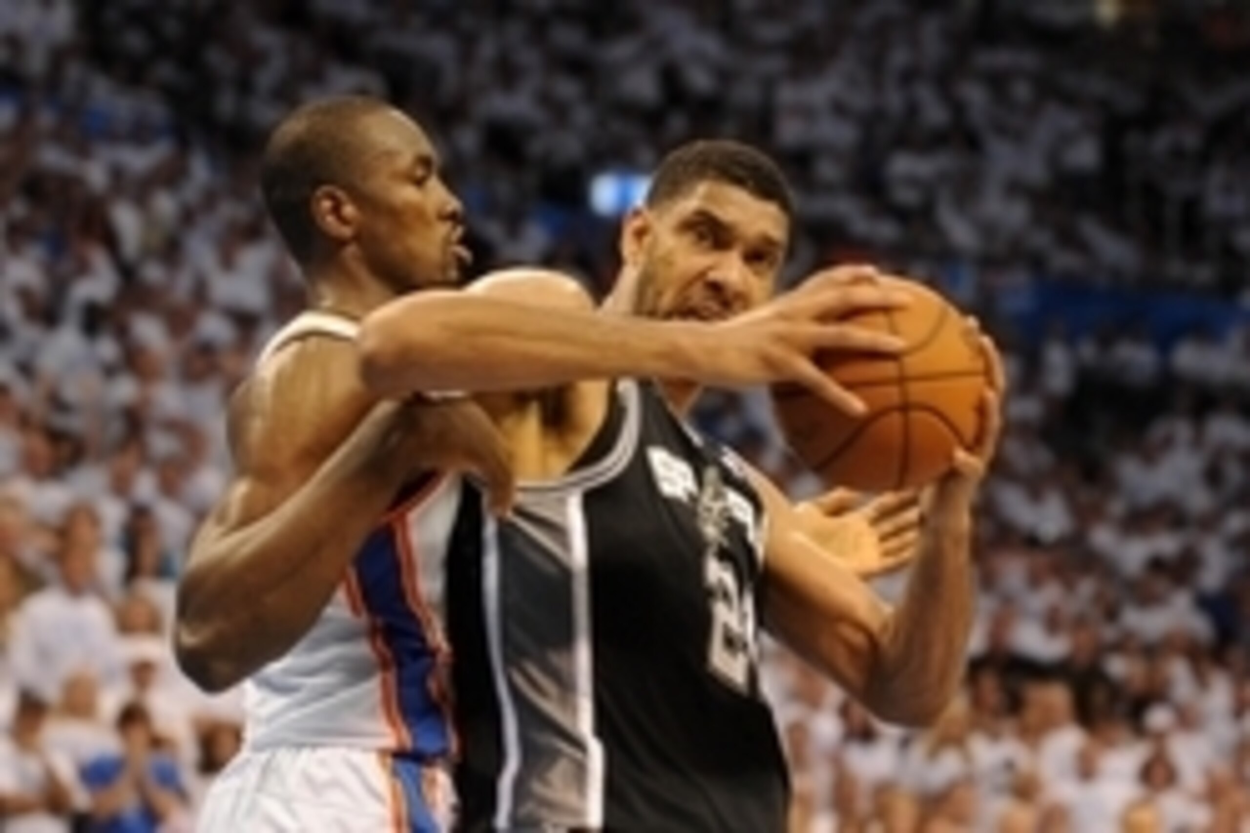 May 31, 2014; Oklahoma City, OK, USA; San Antonio Spurs forward Tim Duncan (21) drives to the basket against Oklahoma City Thunder forward Serge Ibaka (9) during the fourth quarter in game six of the Western Conference Finals of the 2014 NBA Playoffs at C May 31, 2014; Oklahoma City, OK, USA; San Antonio Spurs forward Tim Duncan (21) drives to the basket against Oklahoma City Thunder forward Serge Ibaka (9) during the fourth quarter in game six of the Western Conference Finals of the 2014 NBA Playoffs at C
