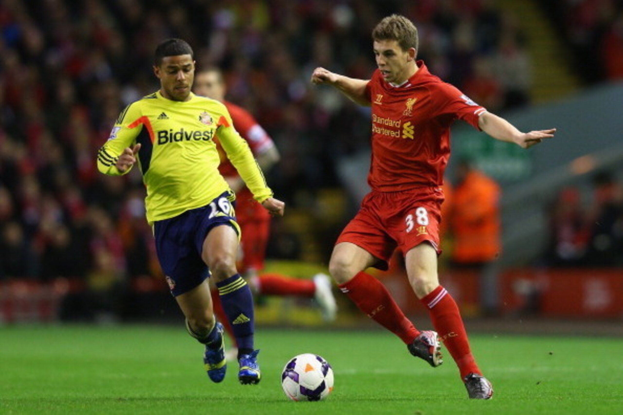 LIVERPOOL, ENGLAND - MARCH 26:  Jon Flanagan of Liverpool competes with Liam Bridcutt of Sunderland
 during the Barclays Premier League match between Liverpool and Sunderland at Anfield on March 26, 2014 in Liverpool, England.  (Photo by Alex Livesey/Gett