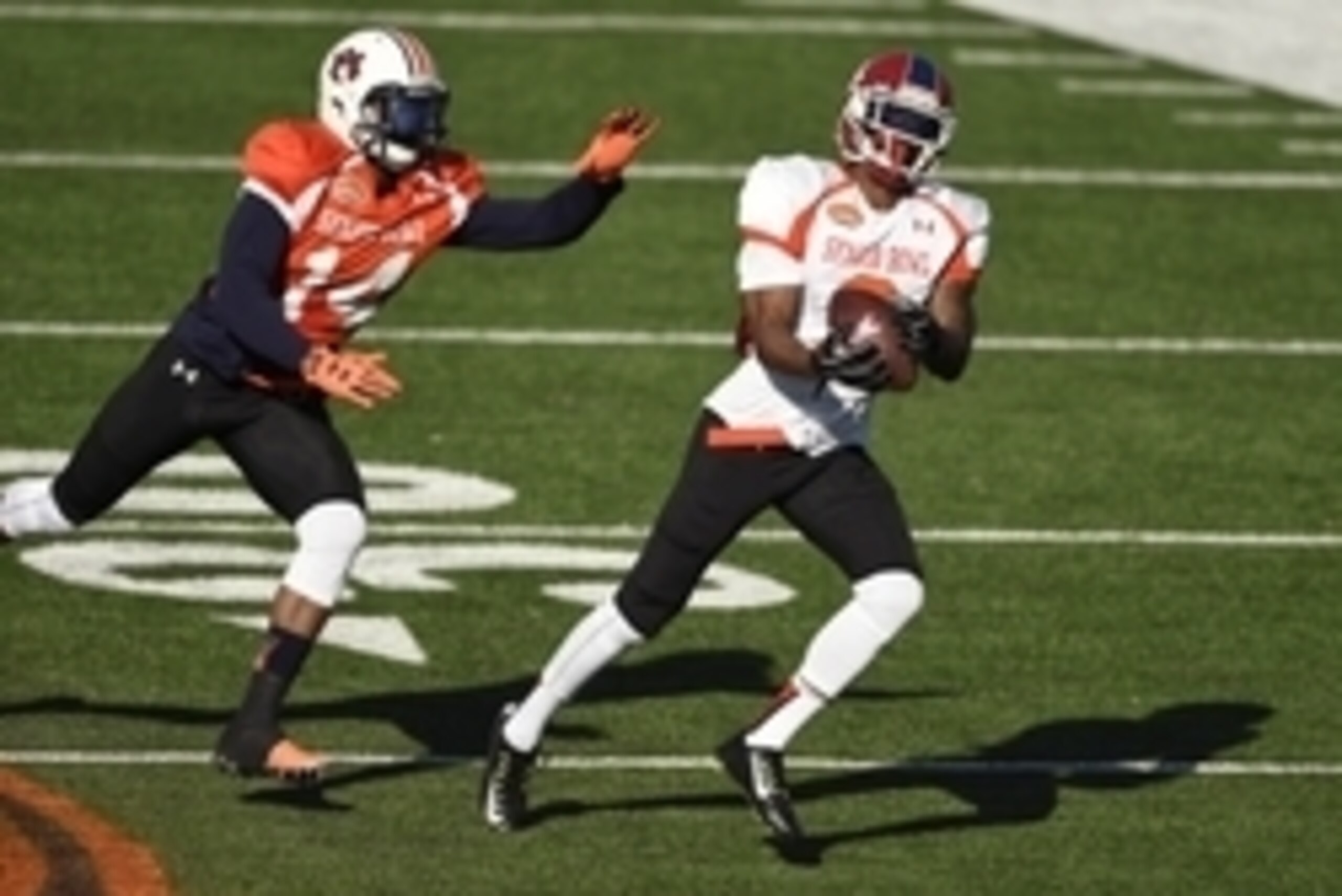 Jan 21, 2015; Mobile, AL, USA; South squad wide receiver Josh Harper of Fresno State (3) pulls in a pass over South squad defensive back Nick Marshall of Auburn (14) during Senior Bowl practice at Ladd-Peebles Stadium. Mandatory Credit: John David Mercer-