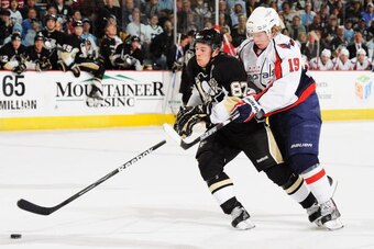PITTSBURGH - JANUARY 21:  Forward Nicklas Backstrom #19 of the Washington Capitals checks forward Sidney Crosby #87 of the Pittsburgh Penguins off the puck on January 21, 2010 at Mellon Arena in Pittsburgh, Pennsylvania.  (Photo by Jamie Sabau/Getty Image