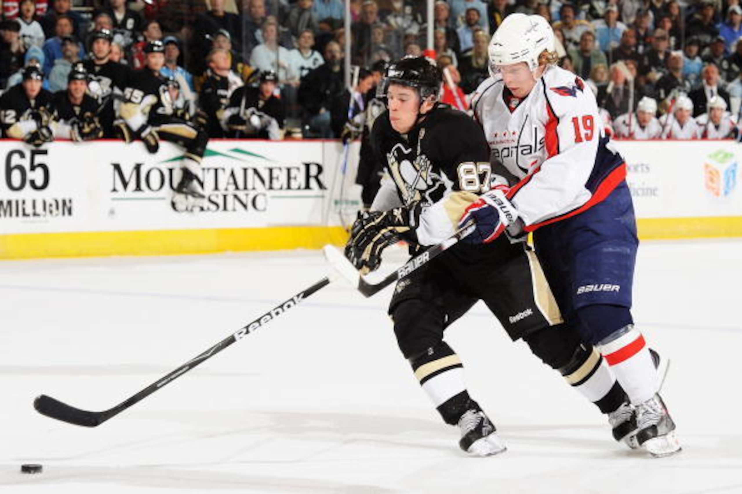 PITTSBURGH - JANUARY 21:  Forward Nicklas Backstrom #19 of the Washington Capitals checks forward Sidney Crosby #87 of the Pittsburgh Penguins off the puck on January 21, 2010 at Mellon Arena in Pittsburgh, Pennsylvania.  (Photo by Jamie Sabau/Getty Image