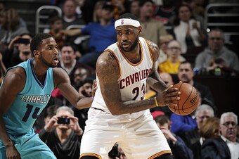 CLEVELAND, OH - JANUARY 23: LeBron James #23 of the Cleveland Cavaliers handles the ball against the Charlotte Hornets at The Quicken Loans Arena on January 23, 2015 in Cleveland, Ohio. NOTE TO USER: User expressly acknowledges and agrees that, by downloa
