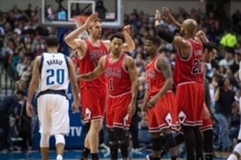 Jan 23, 2015; Dallas, TX, USA; Chicago Bulls forward Pau Gasol (16) and guard Derrick Rose (1) and guard Aaron Brooks (0) and forward Taj Gibson (22) and guard Kirk Hinrich (12) celebrate during the first half against the Dallas Mavericks at the American 