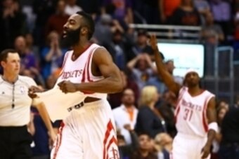 Jan 23, 2015; Phoenix, AZ, USA; Houston Rockets guard James Harden (13) celebrates after hitting the game winning shot at the buzzer against the Phoenix Suns at US Airways Center. The Rockets defeated the Suns 113-111. Mandatory Credit: Mark J. Rebilas-US