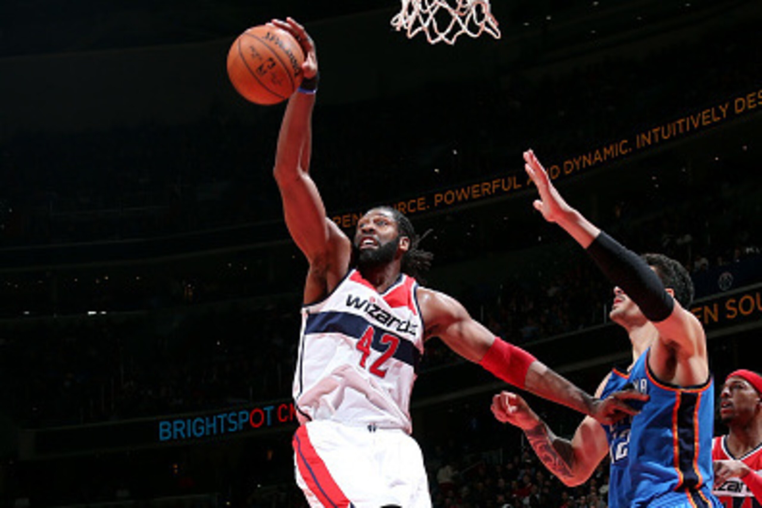 WASHINGTON, DC -  JANUARY 21: Nene Hilario #42 of the Washington Wizards grabs a rebound against the Oklahoma City Thunder on January 21, 2015 at Verizon Center in Washington, DC. NOTE TO USER: User expressly acknowledges and agrees that, by downloading a