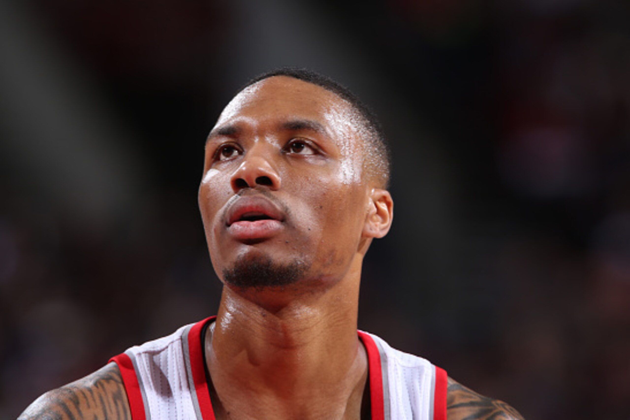 PORTLAND, OR - JANUARY 22:  A close up shot of Damian Lillard #0 of the Portland Trail Blazers during the game against the Boston Celtics on January 22, 2015 at the Moda Center Arena in Portland, Oregon. NOTE TO USER: User expressly acknowledges and agree