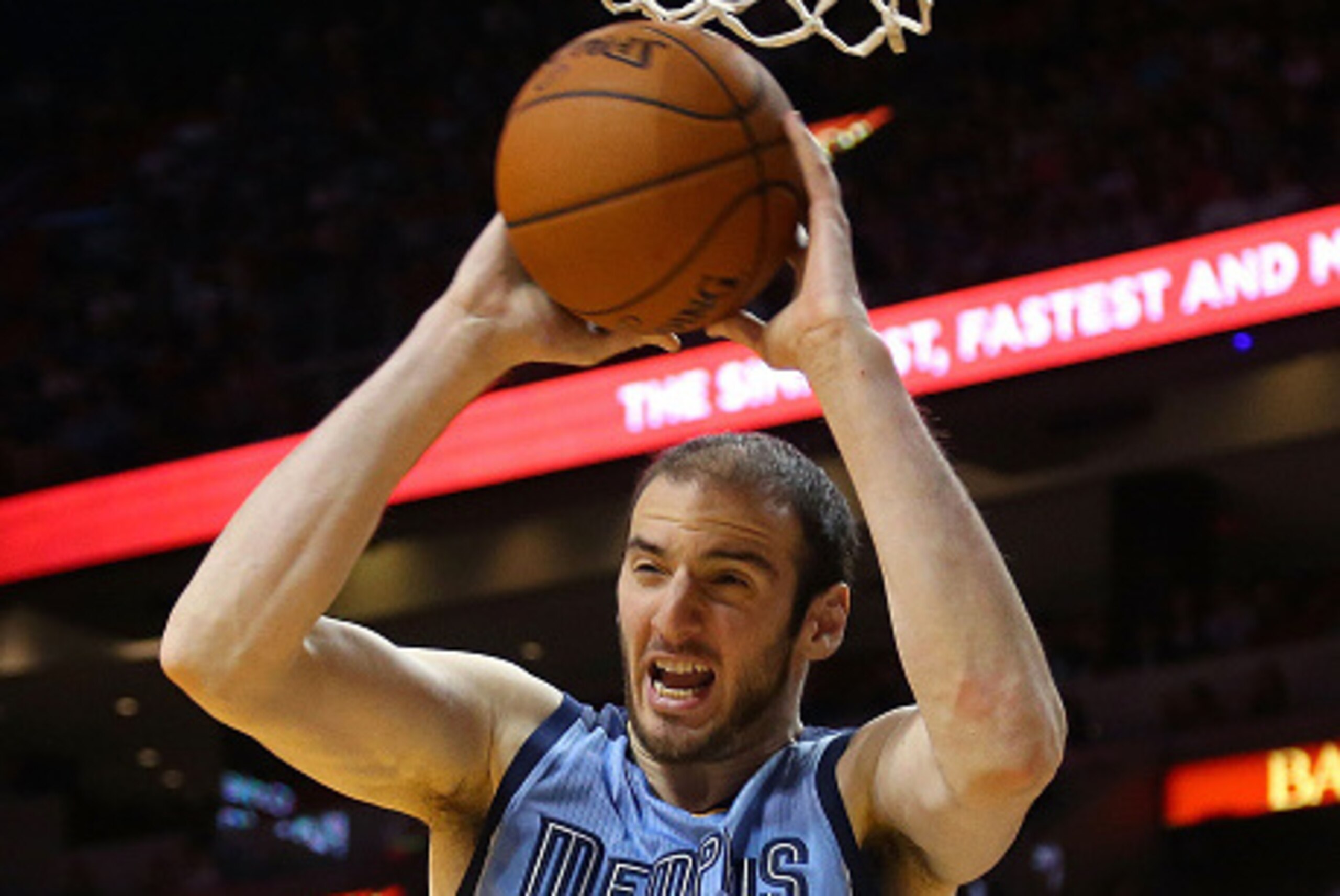 MIAMI, FL - DECEMBER 27: Kosta Koufos #41 of the Memphis Grizzlies passes during a game against the Miami Heat at American Airlines Arena on December 27, 2014 in Miami, Florida. NOTE TO USER: User expressly acknowledges and agrees that, by downloading and