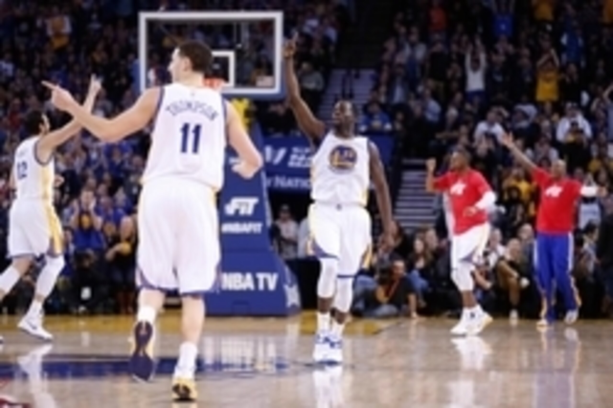 Jan 21, 2015; Oakland, CA, USA; Golden State Warriors center Andrew Bogut (12), guard Klay Thompson (11), and forward Draymond Green (23) celebrate after the Warriors' score against the Houston Rockets during the third quarter at Oracle Arena. The Warrior Jan 21, 2015; Oakland, CA, USA; Golden State Warriors center Andrew Bogut (12), guard Klay Thompson (11), and forward Draymond Green (23) celebrate after the Warriors' score against the Houston Rockets during the third quarter at Oracle Arena. The Warrior