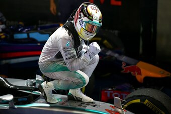 SINGAPORE - SEPTEMBER 21:  Lewis Hamilton of Great Britain and Mercedes GP celebrates in Parc Ferme after winning the Singapore Formula One Grand Prix at Marina Bay Street Circuit on September 21, 2014 in Singapore, Singapore.  (Photo by Mark Thompson/Get