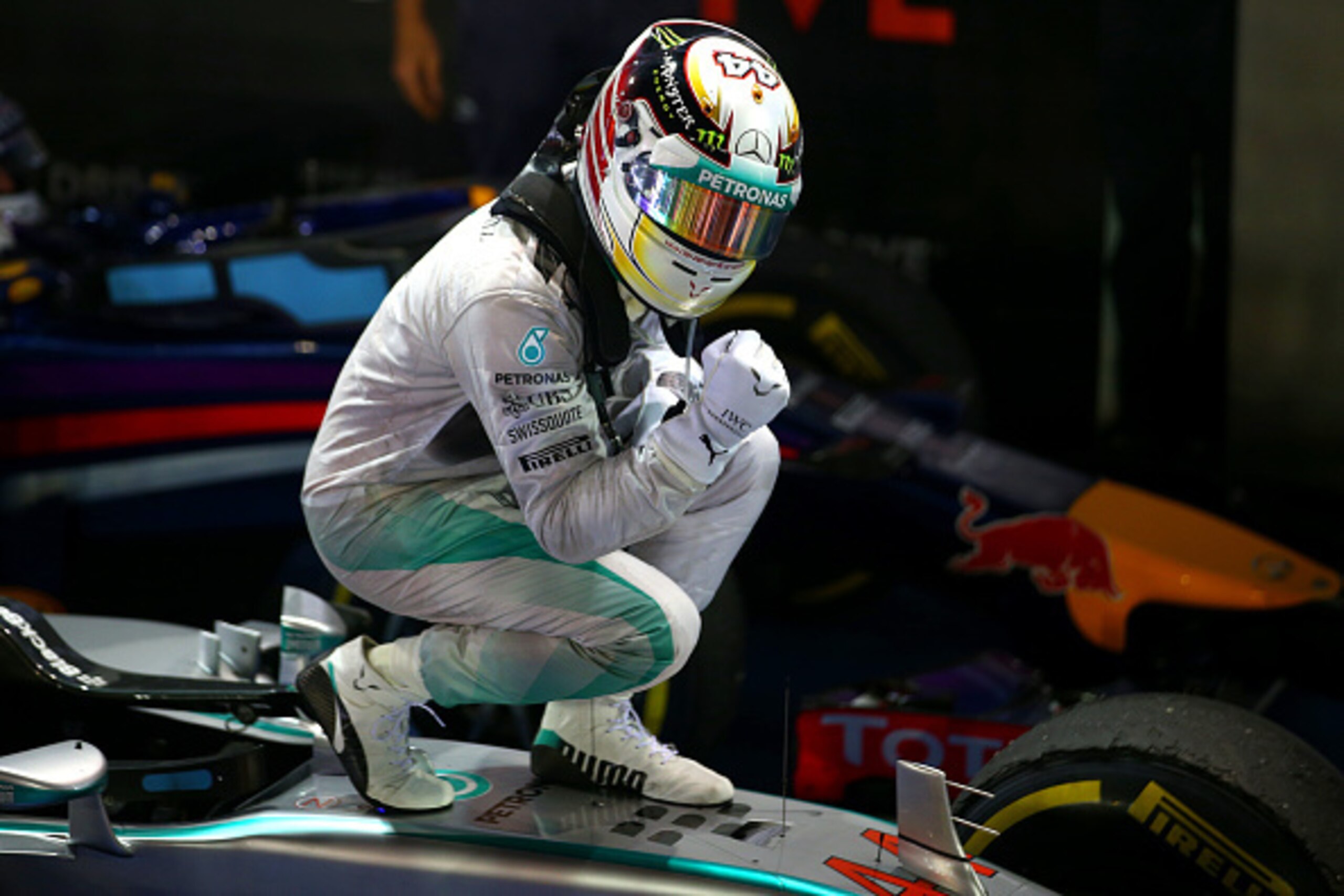 SINGAPORE - SEPTEMBER 21:  Lewis Hamilton of Great Britain and Mercedes GP celebrates in Parc Ferme after winning the Singapore Formula One Grand Prix at Marina Bay Street Circuit on September 21, 2014 in Singapore, Singapore.  (Photo by Mark Thompson/Get