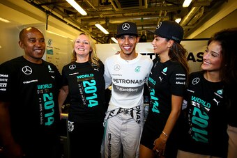 ABU DHABI, UNITED ARAB EMIRATES - NOVEMBER 23:  Lewis Hamilton of Great Britain and Mercedes GP celebrates with his father Anthony Hamilton, stepmother Linda Hamilton and girlfriend Nicole Scherzinger after winning the World Championship after the Abu Dha