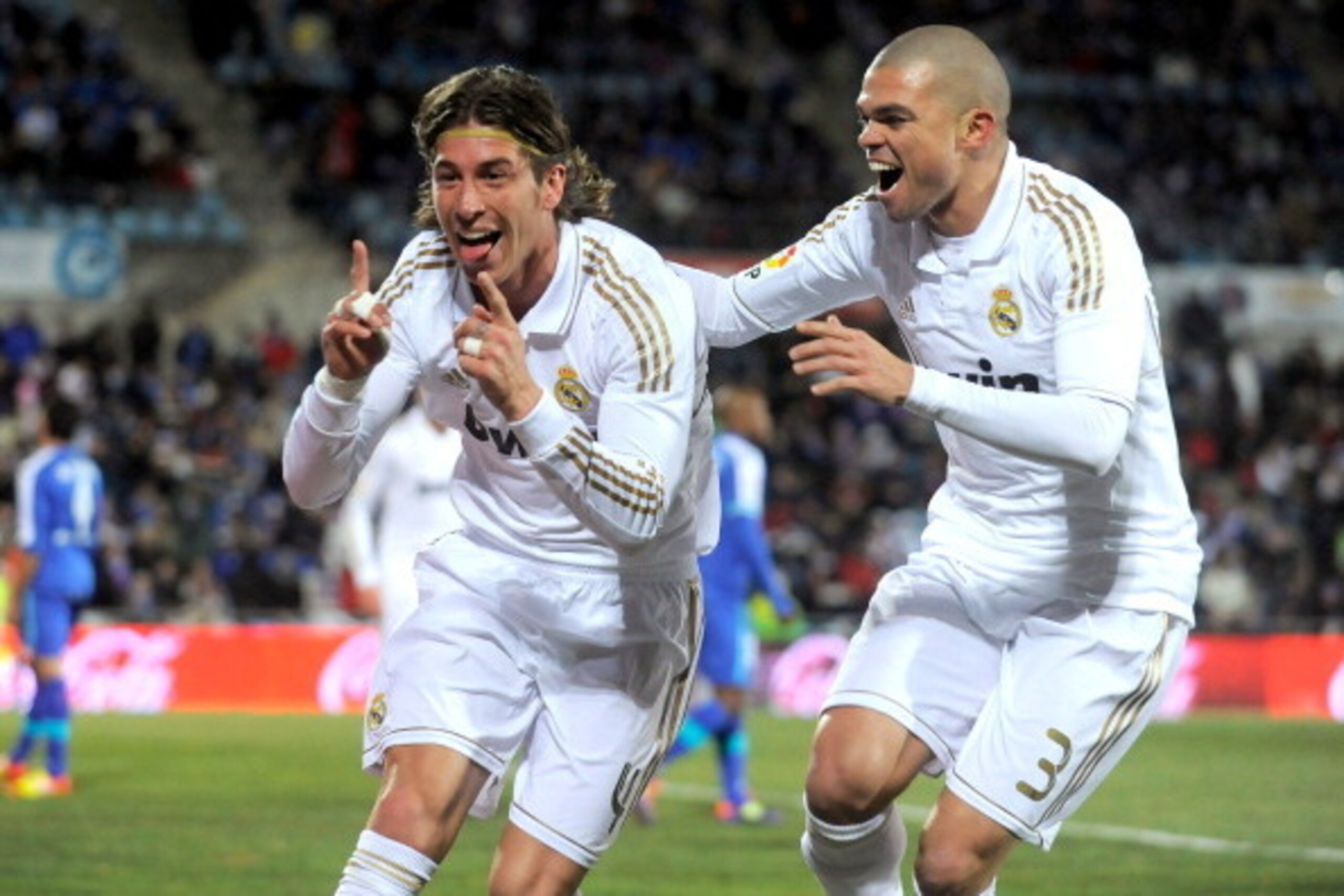 GETAFE, SPAIN - FEBRUARY 04:  Sergio Ramos (L) and Pepe of Real Madrid celebrate after Ramos scored Real's opening goal against Getafe during the La Liga match between Getafe and Real Madrid at Coliseum Alfonso Perez stadium on February 4, 2012 in Getafe,