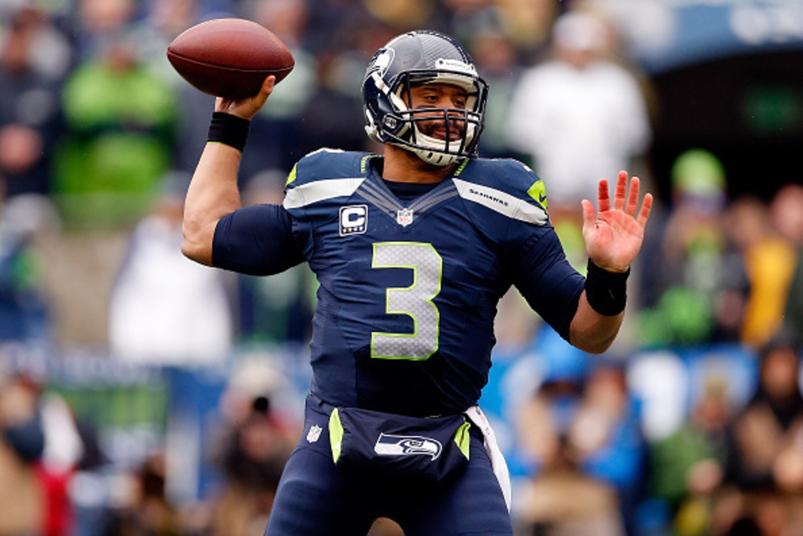 SEATTLE, WA - JANUARY 18: Russell Wilson #3 of the Seattle Seahawks passes the ball during the first quarter of the 2015 NFC Championship game against the Green Bay Packers at CenturyLink Field on January 18, 2015 in Seattle, Washington.  (Photo by Christ