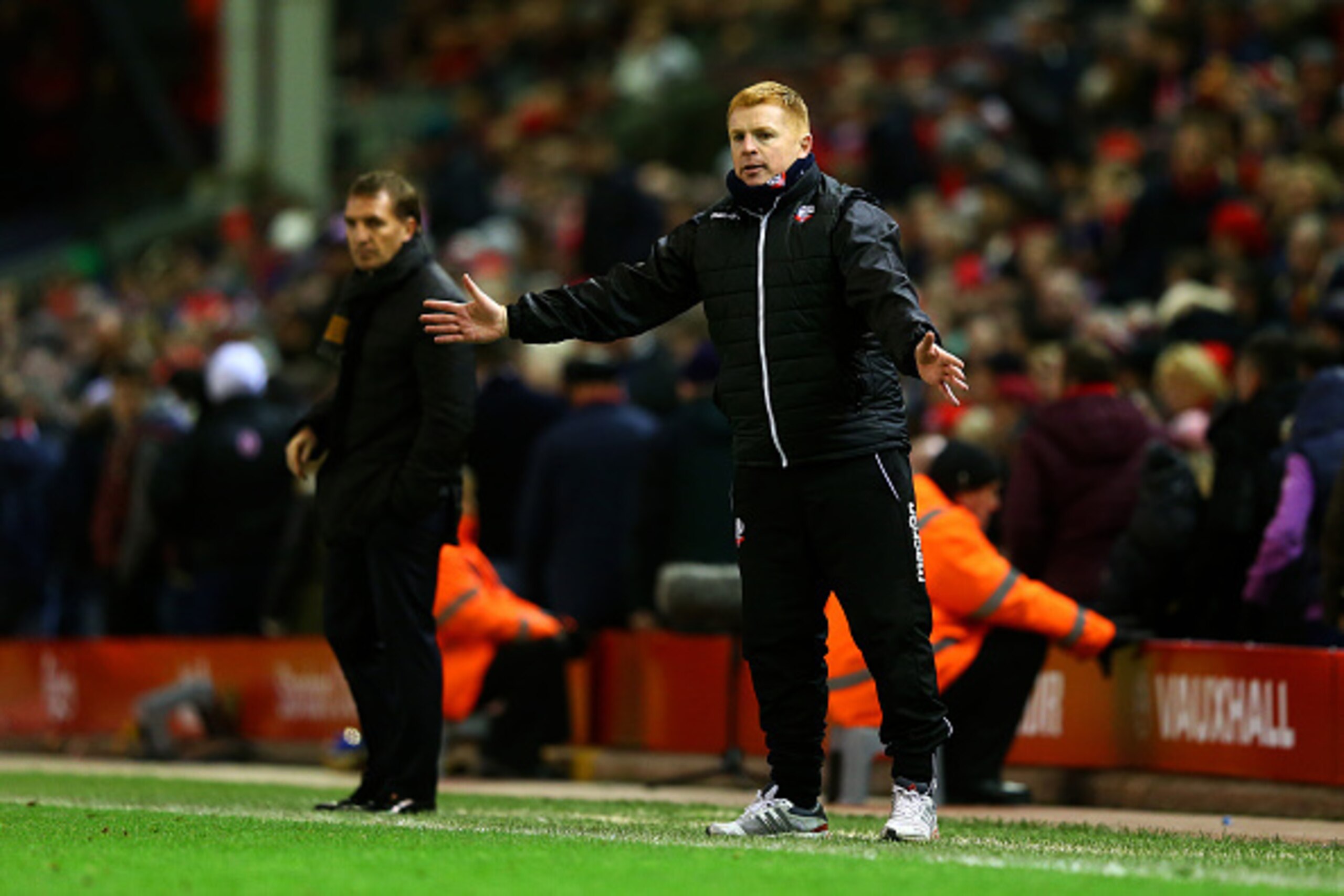 LIVERPOOL, ENGLAND - JANUARY 24:  Neil Lennon, manager of Bolton Wanderers reacts on the touchline next to Brendan Rodgers, manager of Liverpool during the FA Cup Fourth Round match between Liverpool and Bolton Wanderers at Anfield on January 24, 2015 in 