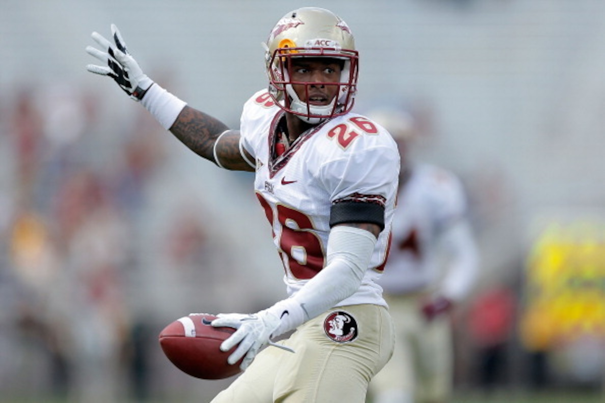 TALLAHASSEE, FL - APRIL 12: P.J. Williams #26 of the Gold team reacts to a recovered fumble against the Garnet team during Florida State's Garnet and Gold spring game at Doak Campbell Stadium on April 12, 2014 in Tallahassee, Florida. (Photo by Stacy Re TALLAHASSEE, FL - APRIL 12: P.J. Williams #26 of the Gold team reacts to a recovered fumble against the Garnet team during Florida State's Garnet and Gold spring game at Doak Campbell Stadium on April 12, 2014 in Tallahassee, Florida. (Photo by Stacy Re