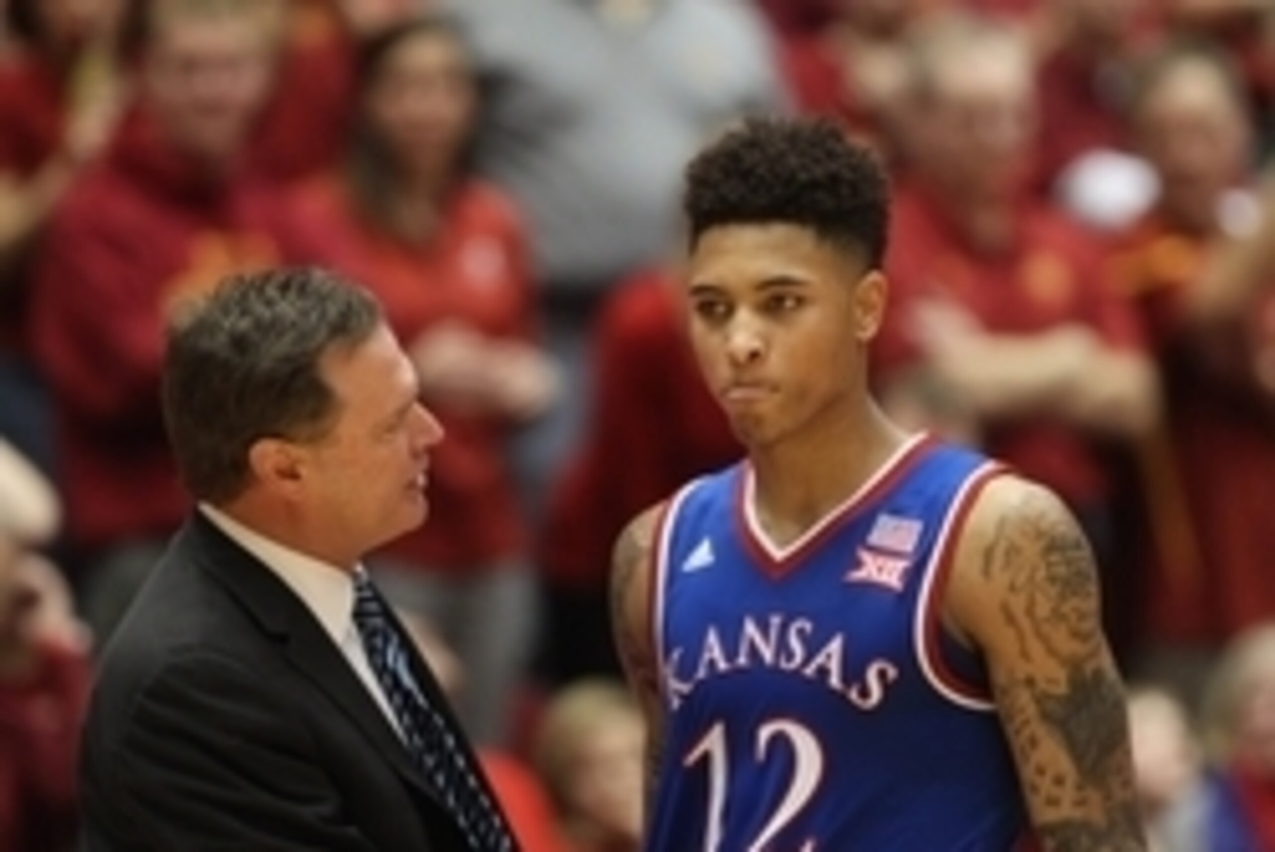 Jan 17, 2015; Ames, IA, USA; Kansas Jayhawks head coach Bill Self talks to Kansas Jayhawks guard Kelly Oubre Jr. (12) during their game with the Iowa State Cyclones at James H. Hilton Coliseum. Iowa State beat Kansas 86-81.  Mandatory Credit: Reese Strick
