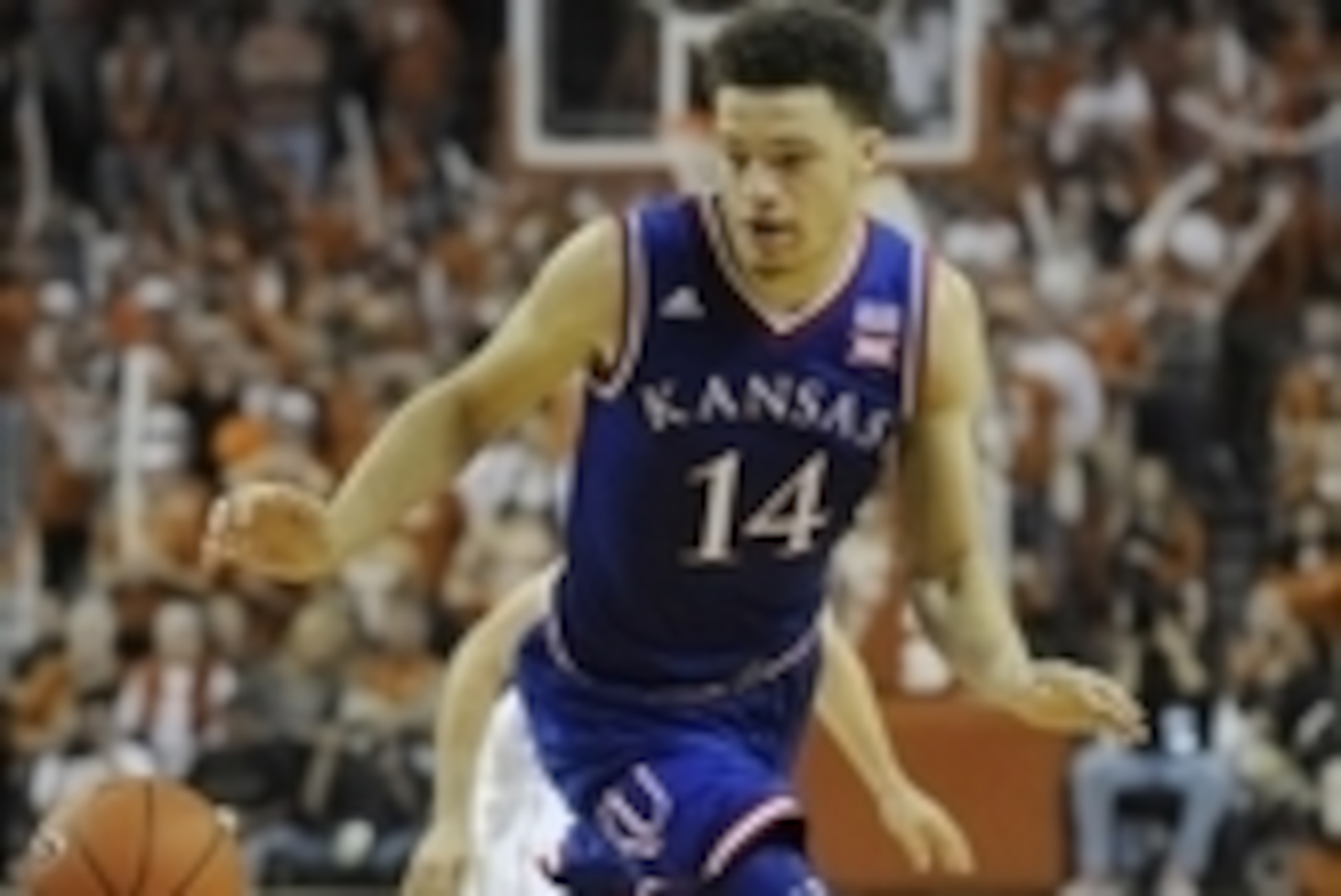 Jan 24, 2015; Austin, TX, USA; Kansas Jayhawks guard Brannen Greene (14) chases the ball against the Texas Longhorns during the second half at the Frank Erwin Special Events Center. The Jayhawks won 75-62. Mandatory Credit: Brendan Maloney-USA TODAY Sport