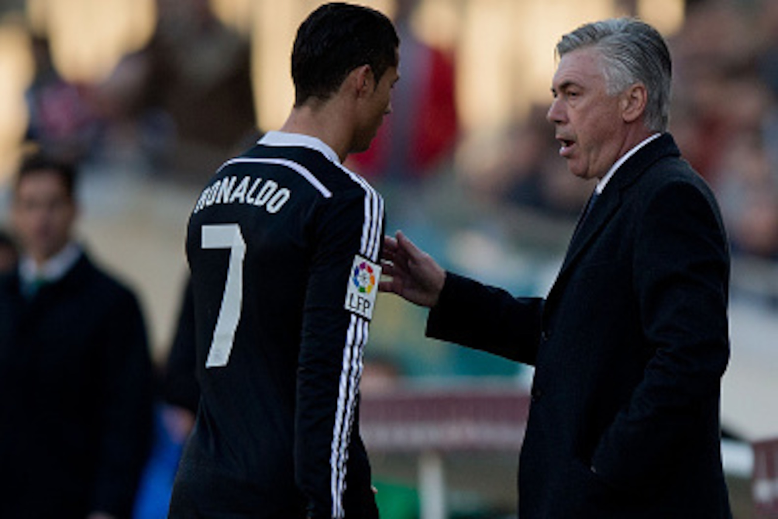 CORDOBA, SPAIN - JANUARY 24: Head coach Carlo Ancelotti (R) of Real Madrid CF speaks to Cristiano Ronaldo (L) as he leaves the pitch after being reprimanded with a red card during the La Liga match between Cordoba CF and Real Madrid CF at El Arcangel stad