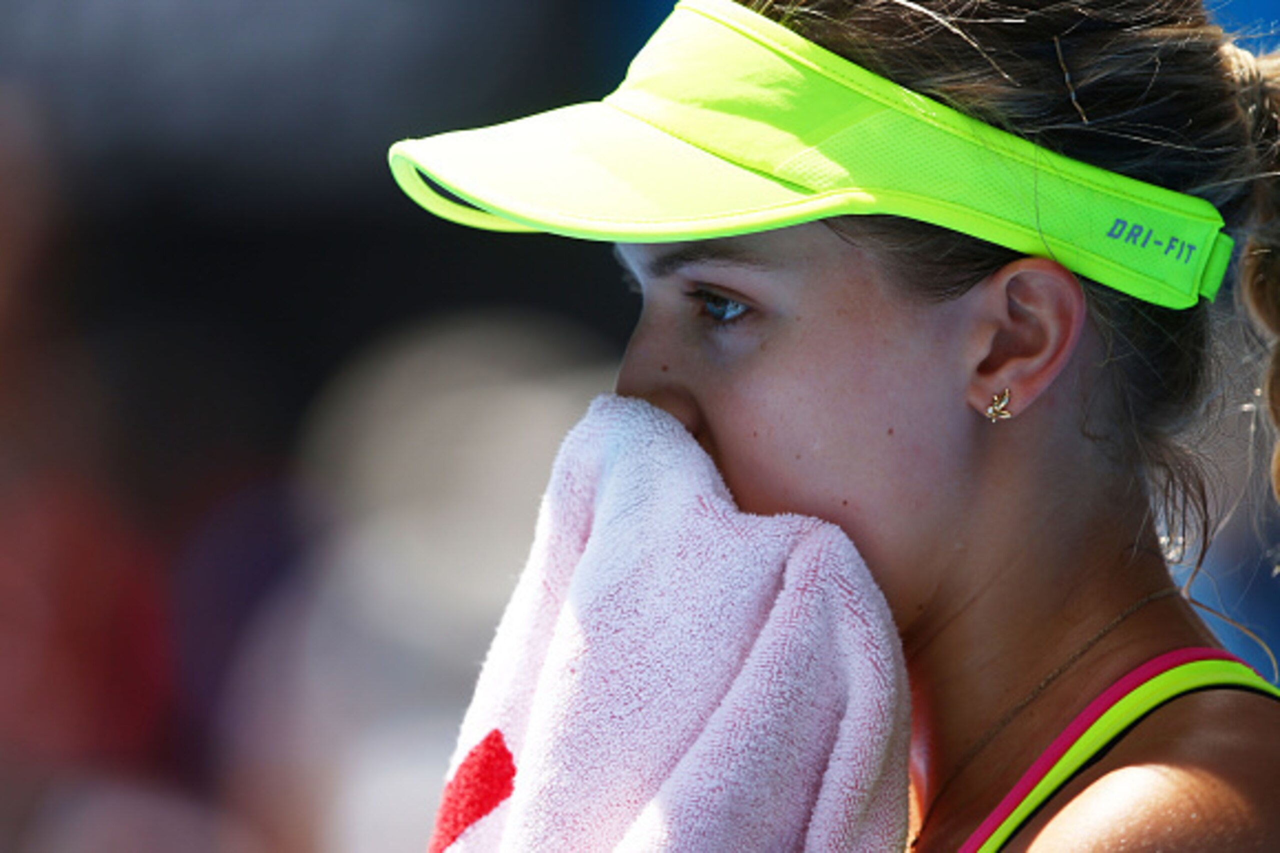MELBOURNE, AUSTRALIA - JANUARY 25:  Eugenie Bouchard of Canada looks on in her fourth round match against Irina-Camelia Begu of Romania during day seven of the 2015 Australian Open at Melbourne Park on January 25, 2015 in Melbourne, Australia.  (Photo by 