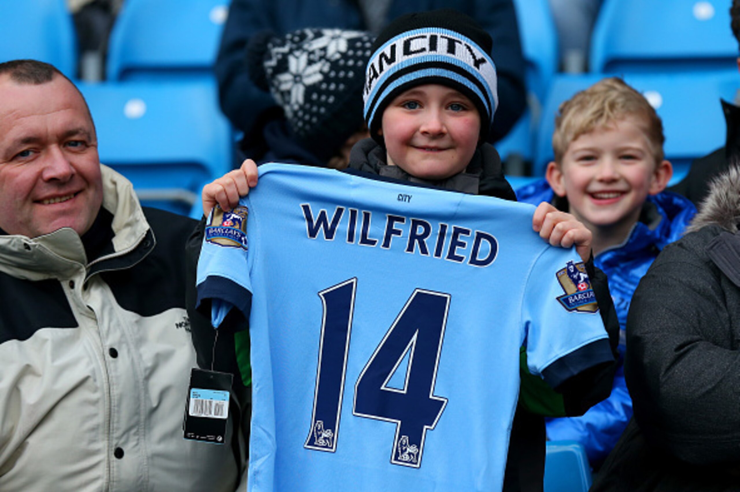 MANCHESTER, ENGLAND - JANUARY 24:  A fan poses with a replica shirt displaying the name of new signing Wilfried Bony before the FA Cup Fourth Round match between Manchester City and Middlesbrough at Etihad Stadium on January 24, 2015 in Manchester, Englan
