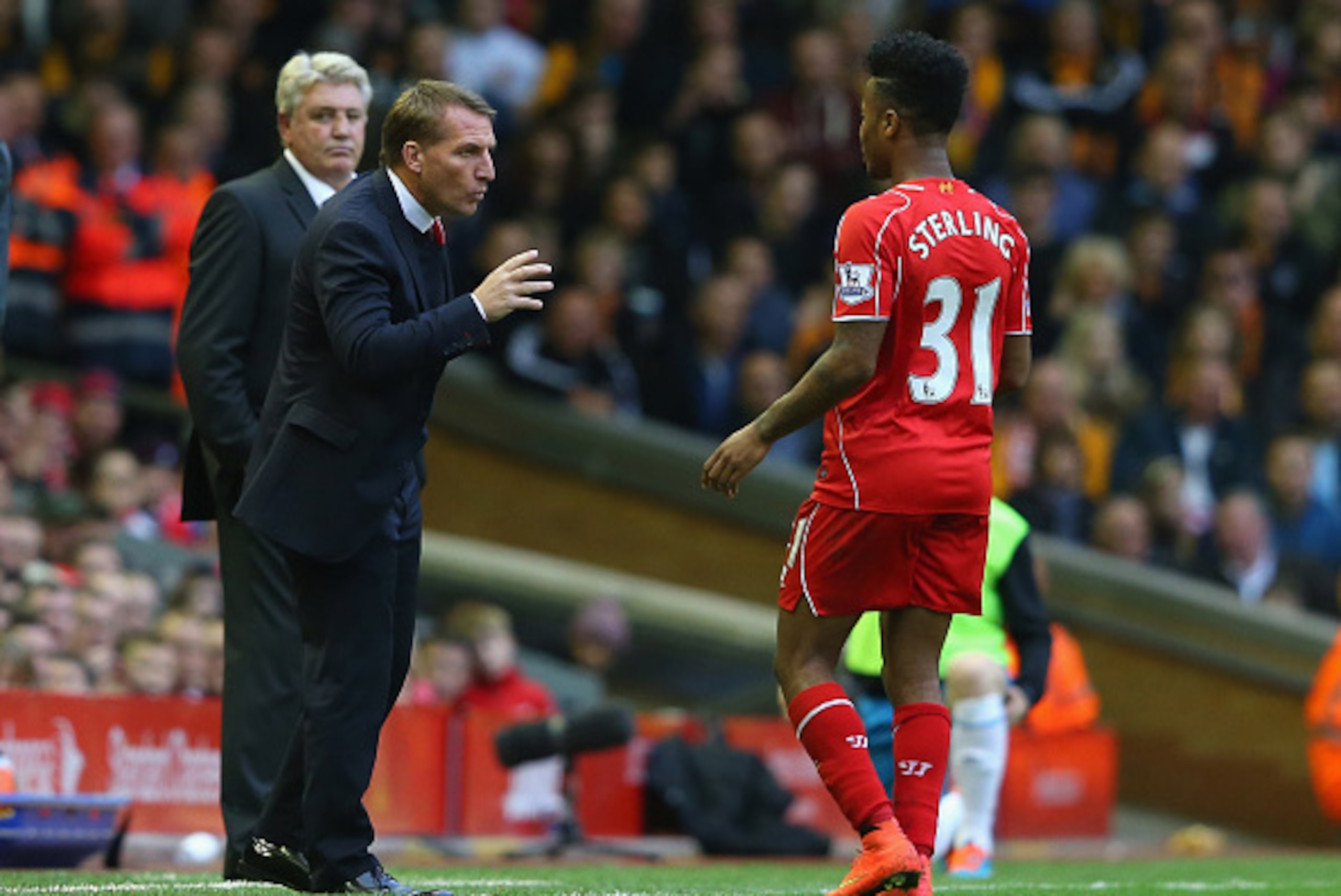 LIVERPOOL, ENGLAND - OCTOBER 25:  Brendan Rodgers the manager of Liverpool talks with Raheem Sterling during the Barclays Premier League match between Liverpool and Hull City at Anfield on October 25, 2014 in Liverpool, England.  (Photo by Alex Livesey/Ge