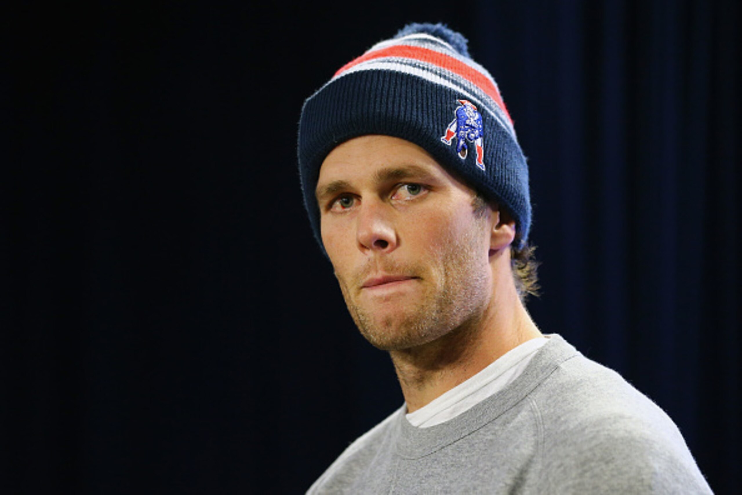 FOXBORO, MA - JANUARY 22: New England Patriots Quarterback Tom Brady talks to the media during a press conference to address the under inflation of footballs used in the AFC championship game at Gillette Stadium on January 22, 2015 in Foxboro, Massachuset