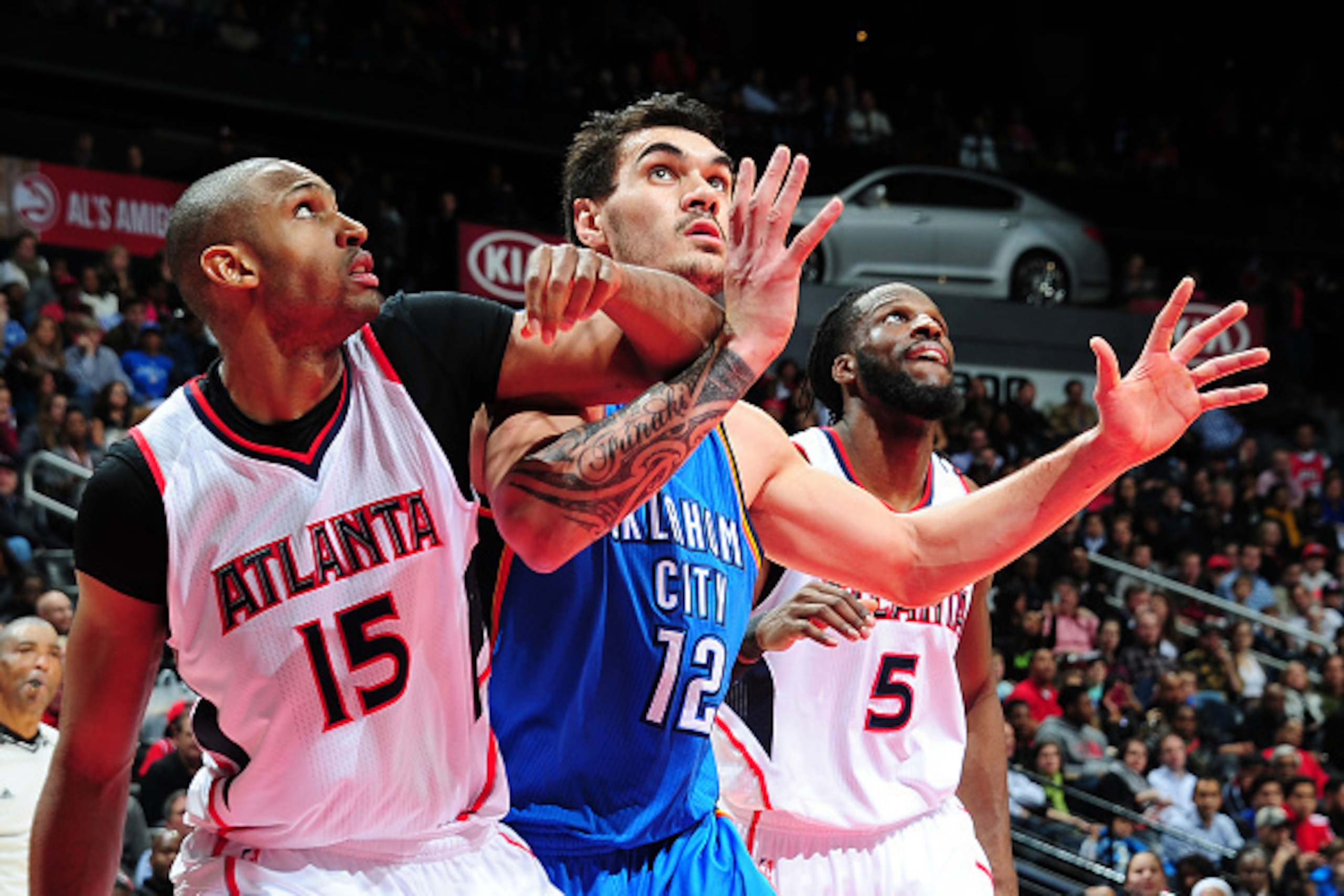 ATLANTA, GA - JANUARY 23: Al Horford #15 and DeMarre Carroll #5 of the Atlanta Hawks box out against Steven Adams #12 of the Oklahoma City Thunder on January 23, 2015 at Philips Arena in Atlanta, Georgia. NOTE TO USER: User expressly acknowledges and agr ATLANTA, GA - JANUARY 23: Al Horford #15 and DeMarre Carroll #5 of the Atlanta Hawks box out against Steven Adams #12 of the Oklahoma City Thunder on January 23, 2015 at Philips Arena in Atlanta, Georgia. NOTE TO USER: User expressly acknowledges and agr