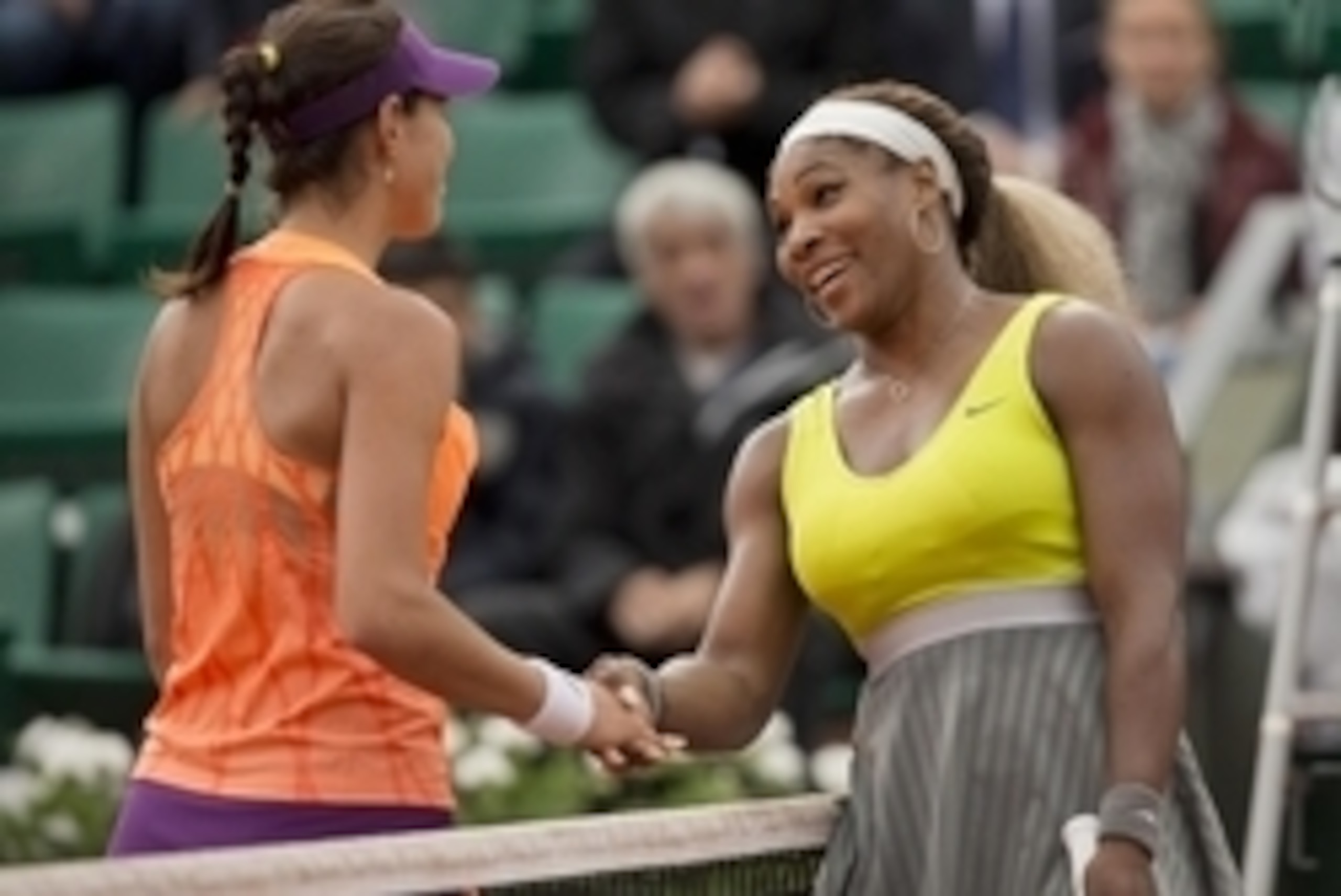 May 28, 2014; Paris, France; Serena Williams (USA), right, shakes hands with Garbine Muguruza (ESP) after their match on day four at the 2014 French Open at Roland Garros. Mandatory Credit: Susan Mullane-USA TODAY Sports