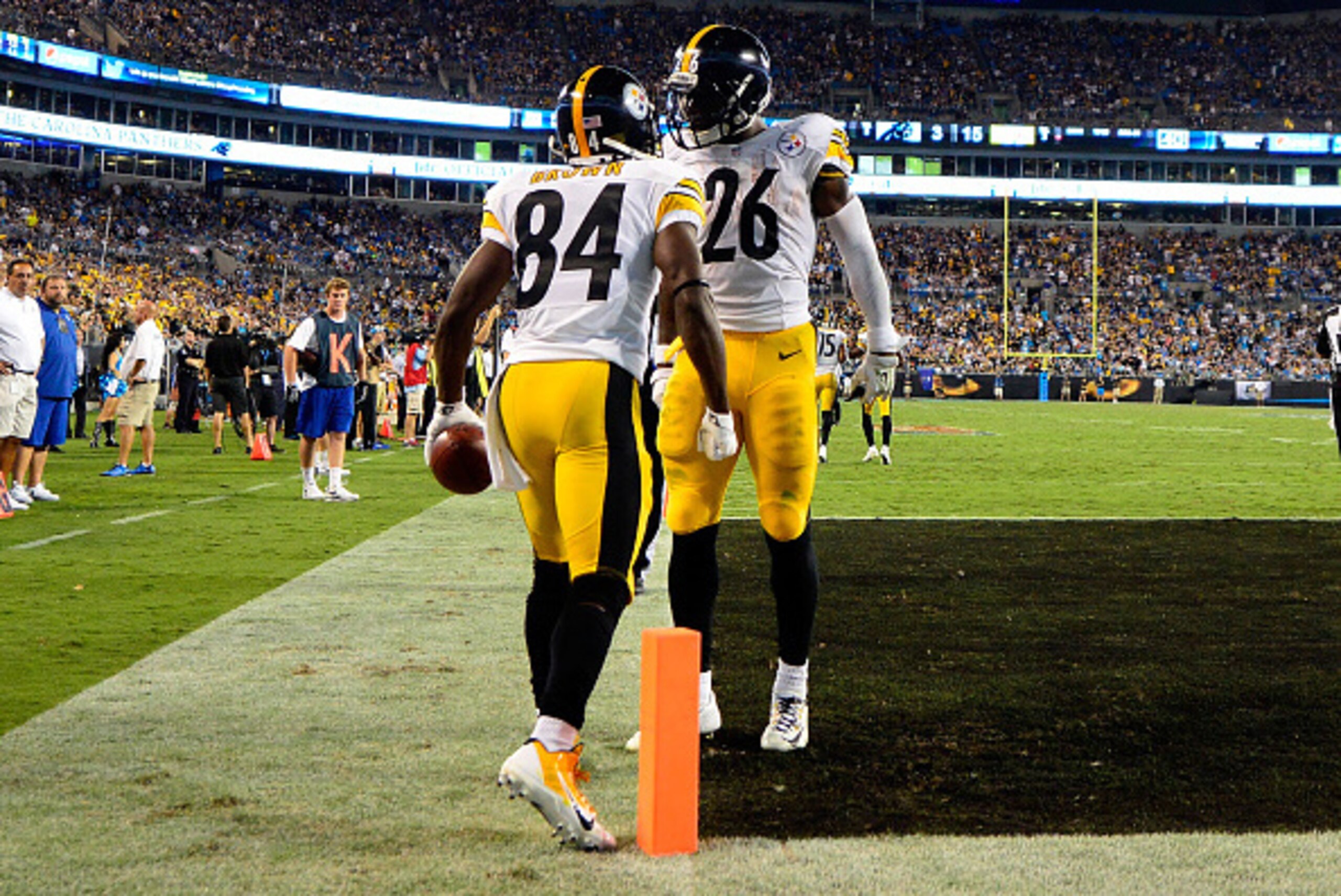 CHARLOTTE, NC - SEPTEMBER 21: Antonio Brown #84 and Le'Veon Bell #26 of the Pittsburgh Steelers celebrate a 3rd quarter touchdown against the Carolina Panthers during their game at Bank of America Stadium on September 21, 2014 in Charlotte, North Carolina