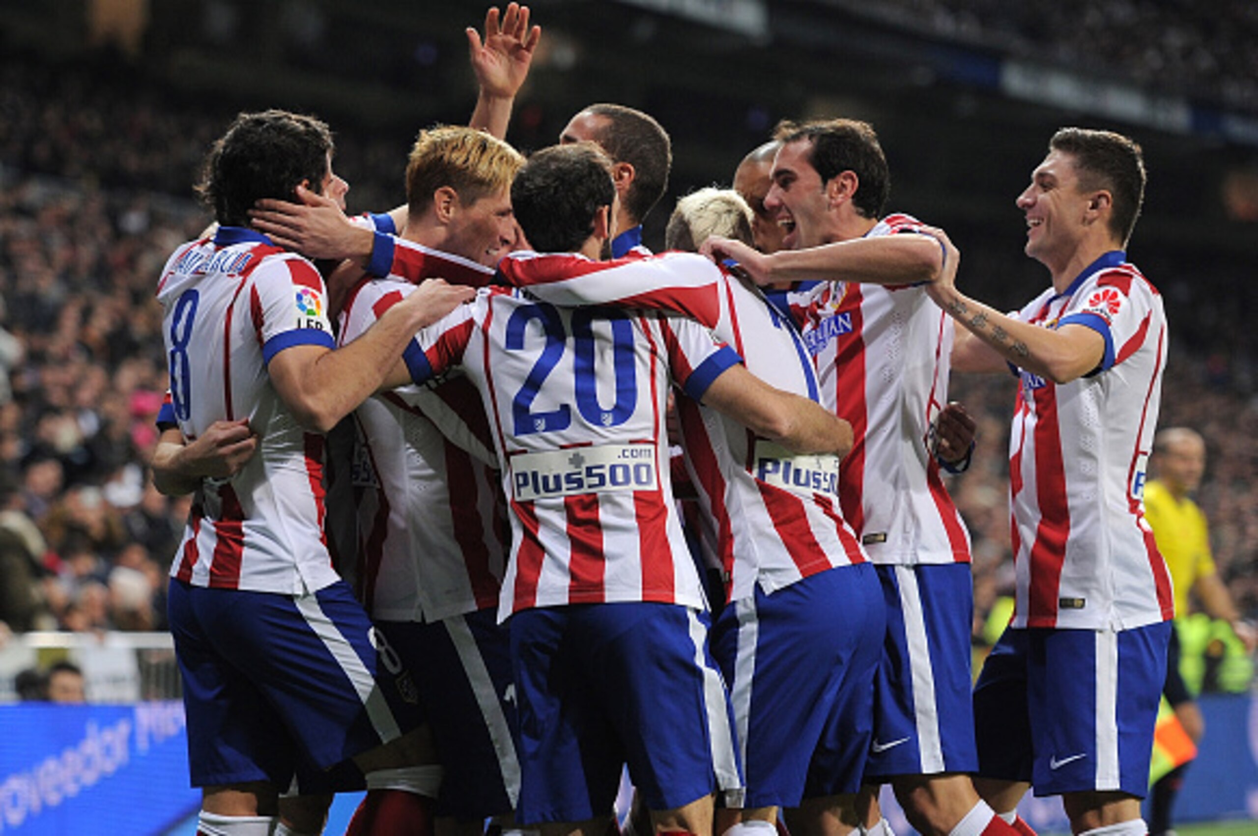 MADRID, SPAIN - JANUARY 15:  Fernando Torres of Atletico de Madrid celebrates with team mates after scoring Atletico's opening goal during the Copa del Rey Round of 16, Second leg match between Real Madrid and Atletico de Madrid at Estadio Santiago Bernab