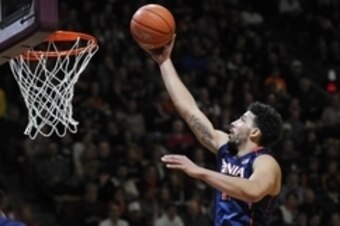 Jan 25, 2015; Blacksburg, VA, USA; Virginia Cavaliers forward Anthony Gill (13) shoots a layup against the Virginia Tech Hokies in the first half at Cassell Coliseum. Mandatory Credit: Michael Shroyer-USA TODAY Sports