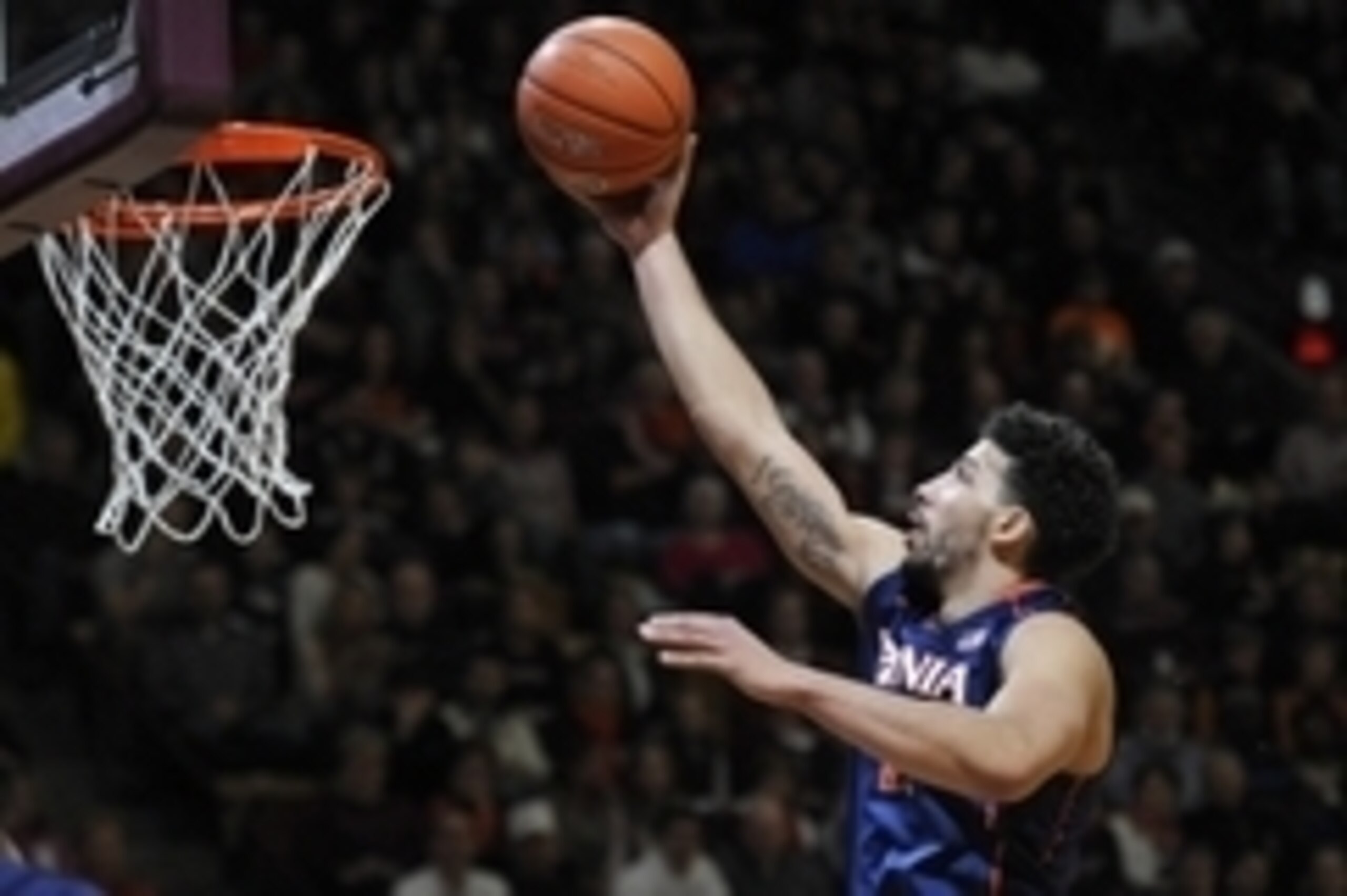Jan 25, 2015; Blacksburg, VA, USA; Virginia Cavaliers forward Anthony Gill (13) shoots a layup against the Virginia Tech Hokies in the first half at Cassell Coliseum. Mandatory Credit: Michael Shroyer-USA TODAY Sports