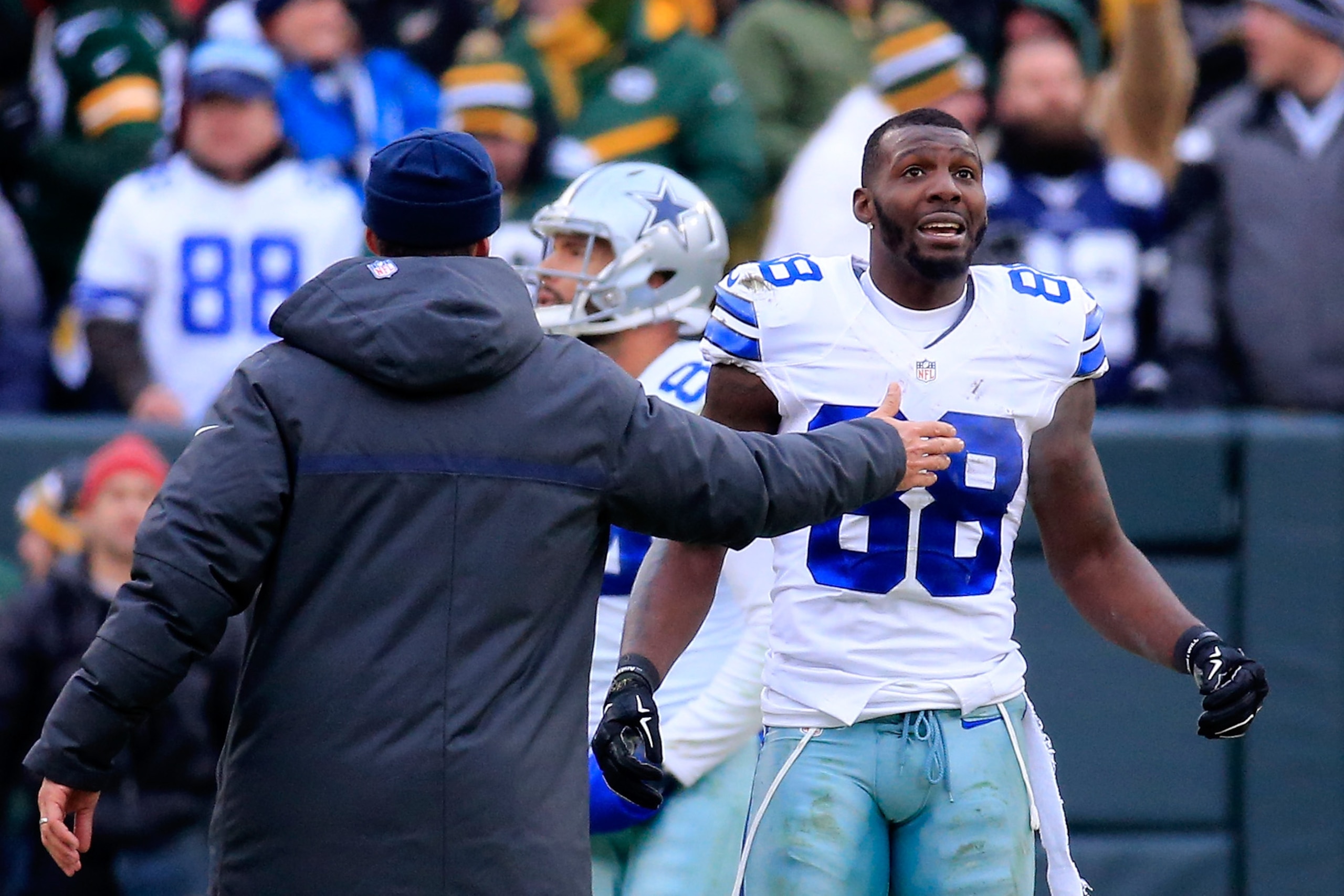 GREEN BAY, WI - JANUARY 11:  Dez Bryant #88 of the Dallas Cowboys waits for a replay on a call late in the fourth quarter against the Green Bay Packers during the 2015 NFC Divisional Playoff game at Lambeau Field on January 11, 2015 in Green Bay, Wisconsi