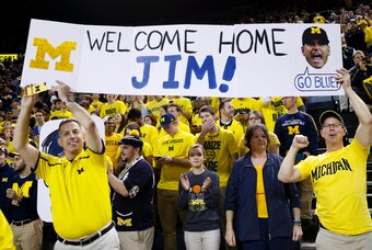 Dec 30, 2014; Ann Arbor, MI, USA; Fans hold up a sign for new Michigan Wolverines head football coach Jim Harbaugh during halftime of the basketball game against the Illinois Fighting Illini at Crisler Center. Mandatory Credit: Rick Osentoski-USA TODAY Sp