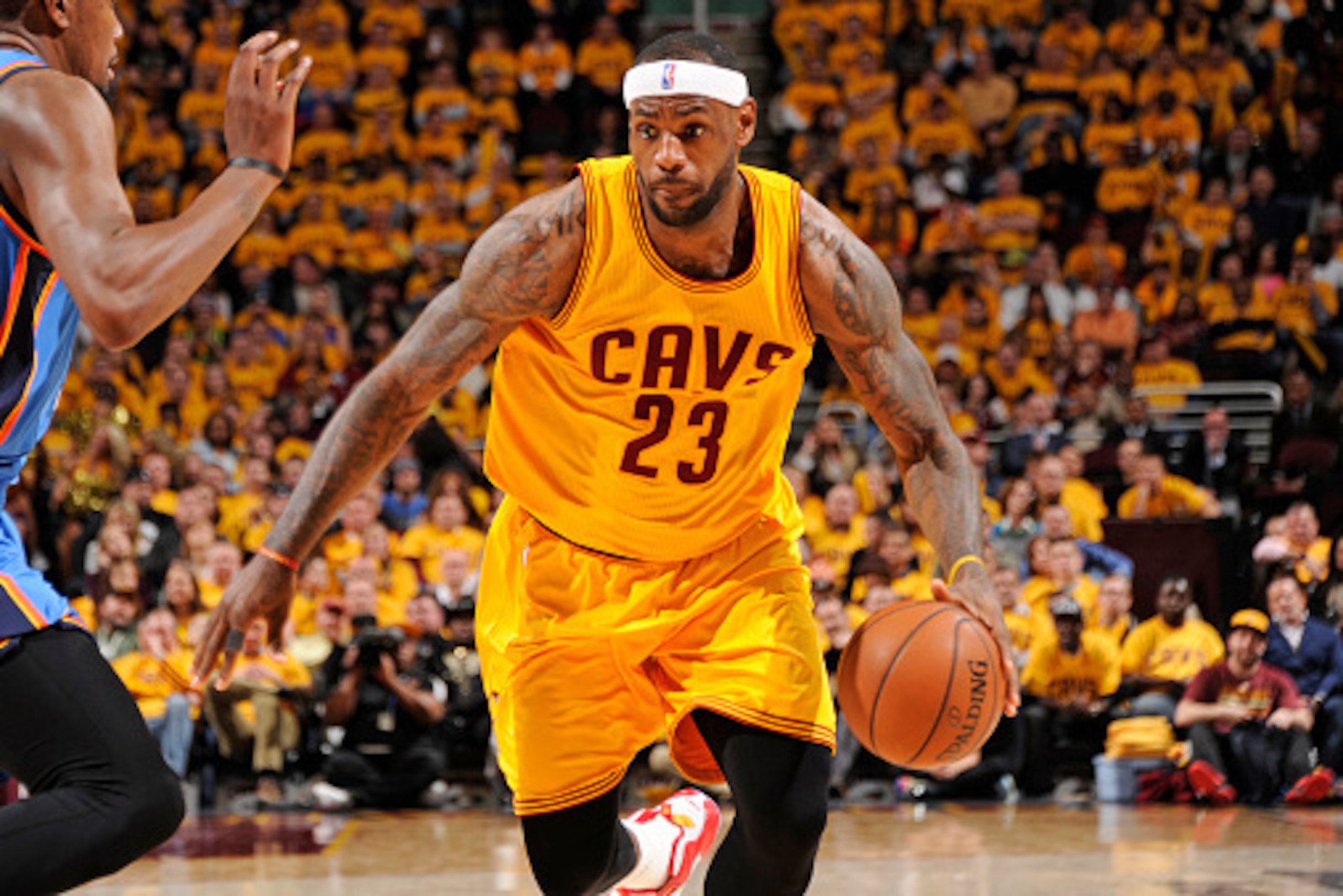 CLEVELAND, OH - JANUARY 25:  LeBron James #23 of the Cleveland Cavaliers handles the ball against Kevin Durant #35 of the Oklahoma City Thunder during the game on January 25, 2015 at Quicken Loans Arena in Cleveland, Ohio. NOTE TO USER: User expressly ack