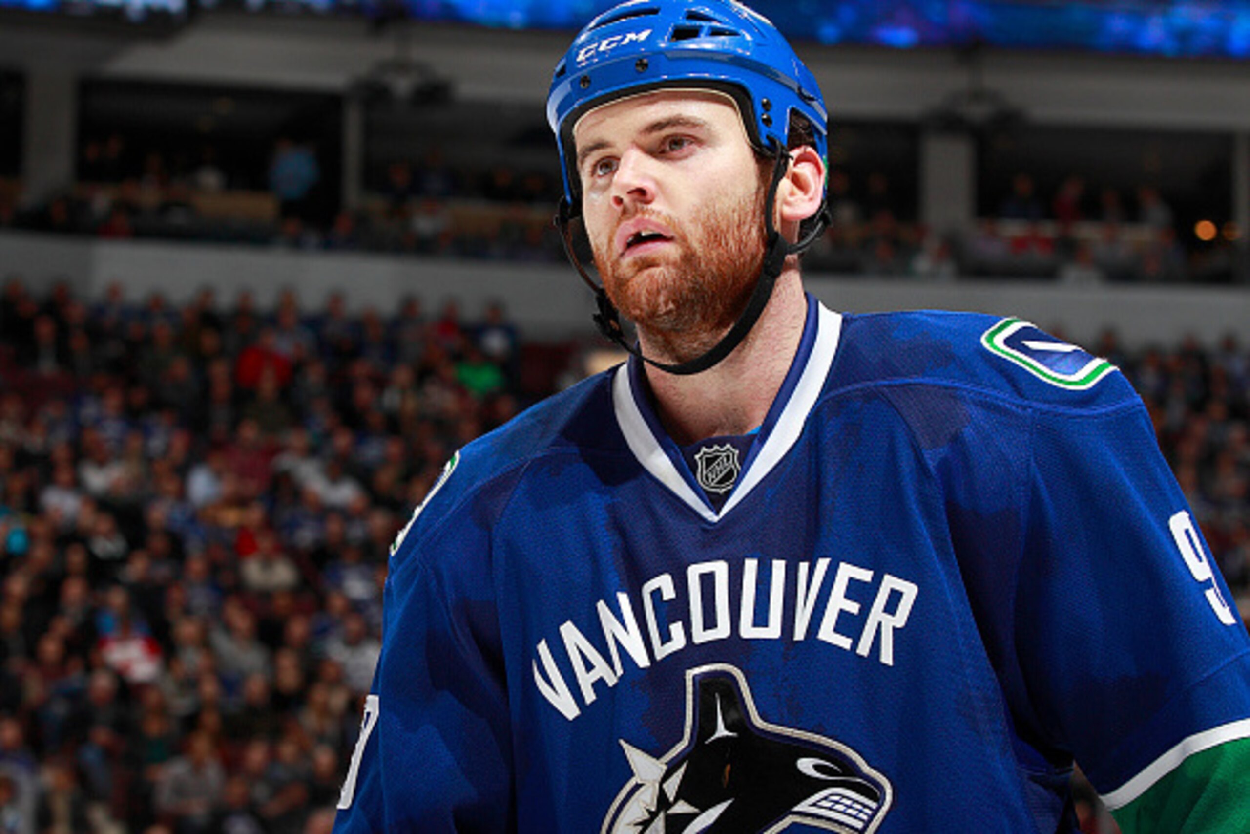 VANCOUVER, BC - JANUARY 8:  Zack Kassian #9 of the Vancouver Canucks looks on from the bench during their NHL game against the Florida Panthers at Rogers Arena January 8, 2015 in Vancouver, British Columbia, Canada.  (Photo by Jeff Vinnick/NHLI via Getty 