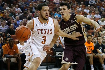 AUSTIN, TX - DECEMBER 13: Javan Felix #3 of the Texas Longhorns drives around Ethan Montalvo #15 of the Texas State Bobcats at the Frank Erwin Center on December 13, 2014 in Austin, Texas. (Photo by Chris Covatta/Getty Images)