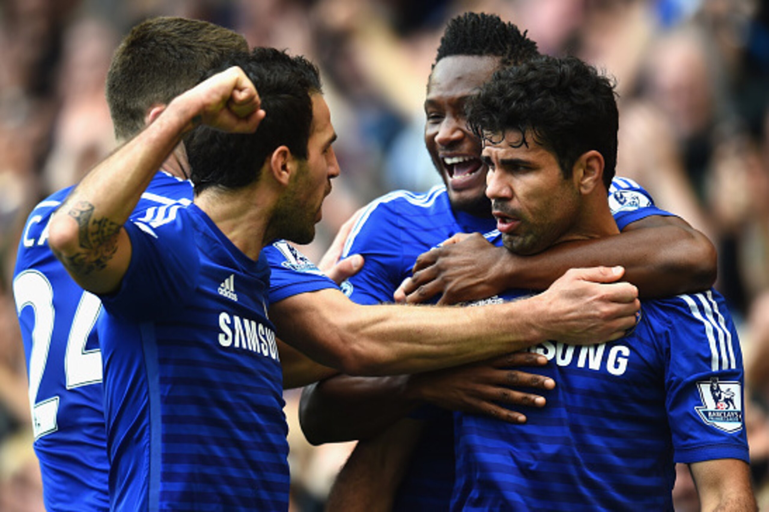 LONDON, ENGLAND - OCTOBER 05:  Diego Costa of Chelsea celebrates scoring their second goal with John Obi Mikel and Cesc Fabregas of Chelsea during the Barclays Premier League match between Chelsea and Arsenal at Stamford Bridge on October 4, 2014 in Londo
