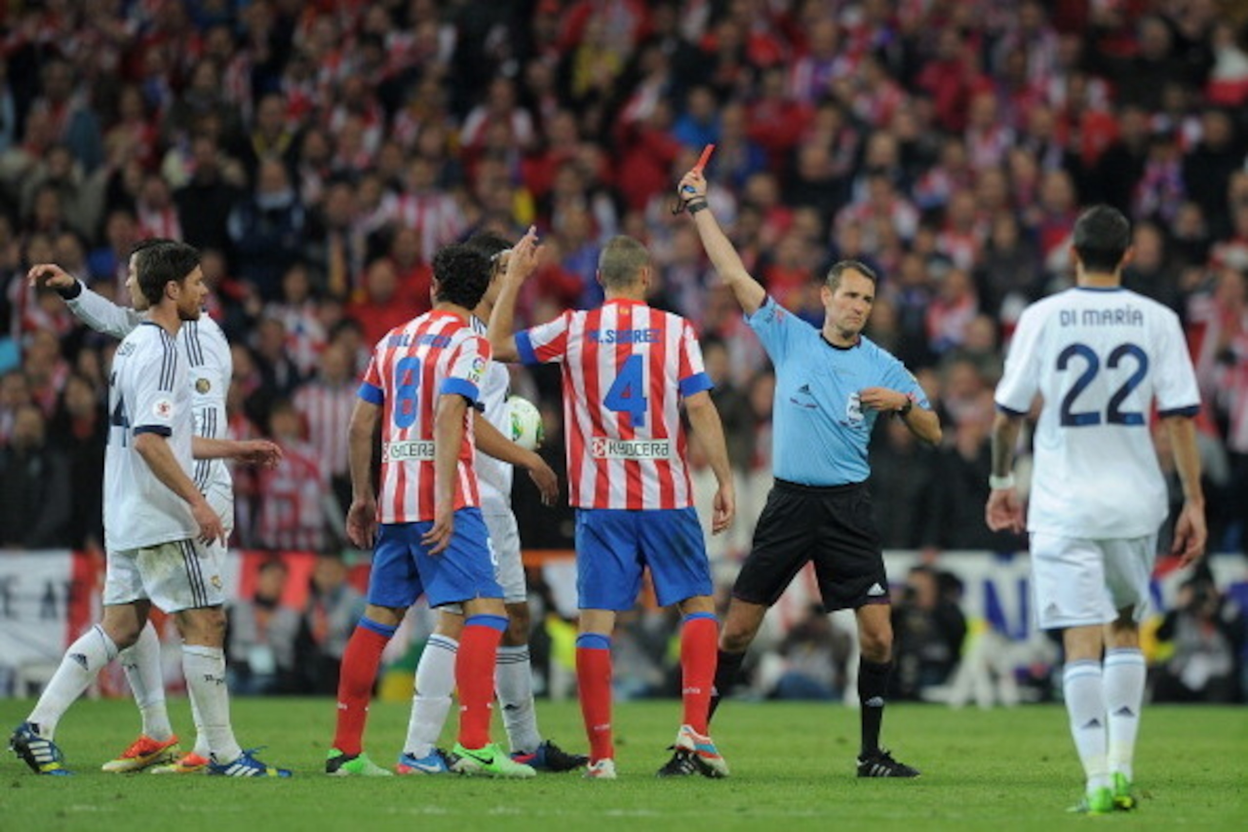 MADRID, SPAIN - MAY 17:  Cristiano Ronaldo (L) of Real Madrid is sent off by referee Carlos Clos Gomez during the Copa del Rey Final between Real Madrid CF and Club Atletico de Madrid at Estadio Santiago Bernabeu on May 17, 2013 in Madrid, Spain.  (Photo 