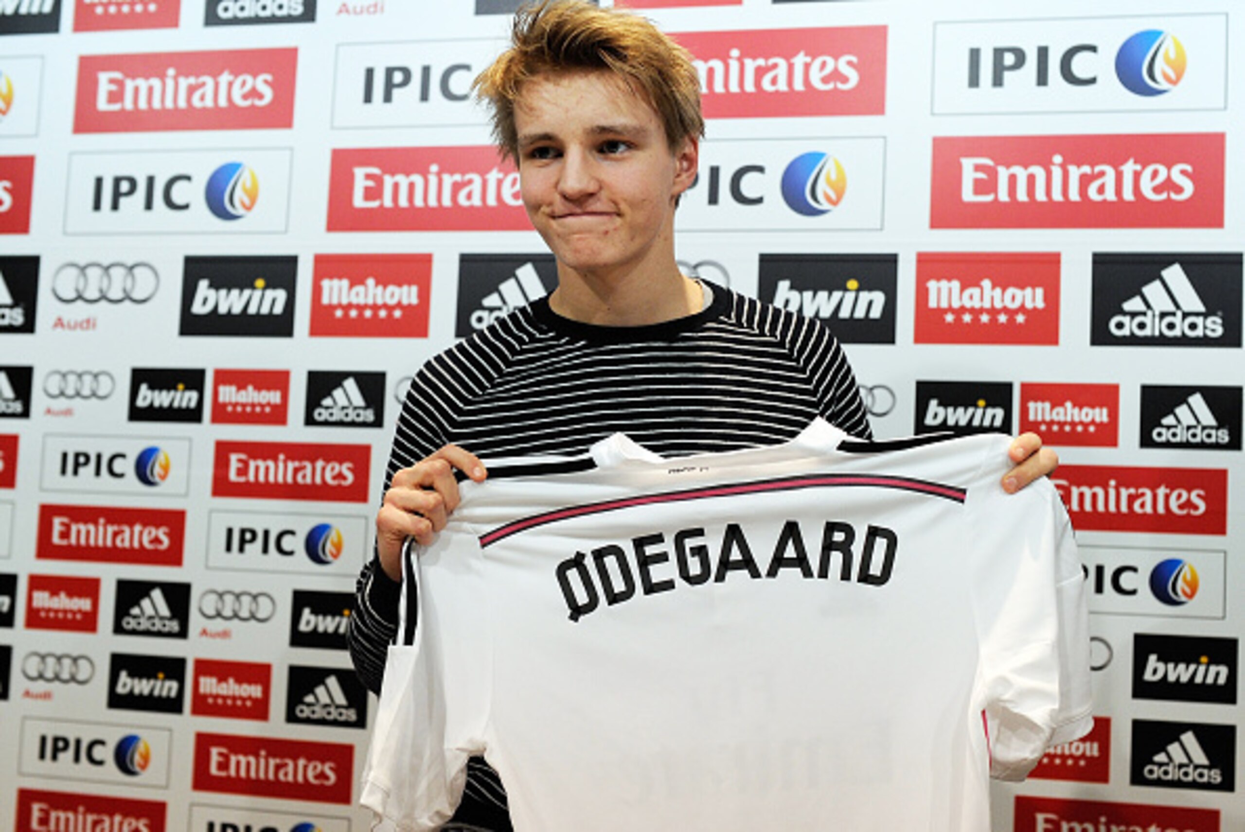 MADRID, SPAIN - JANUARY 22:  Martin Odegaard from Norway holds his new Real Madrid shirt during a press conference at Real Madrid's Valdebebas training grounds after he signed with Real on January 22, 2015 in Madrid, Spain. Odegaard aged 16 will play for 