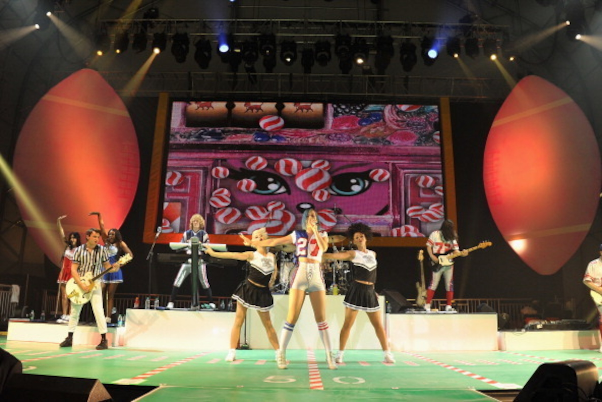 INDIANAPOLIS, IN - FEBRUARY 04:  Katy Perry (C) performs onstage at DIRECTV's Sixth Annual Celebrity Beach Bowl After Party at Victory Field on February 4, 2012 in Indianapolis, Indiana.  (Photo by Theo Wargo/Getty Images for DirecTV)