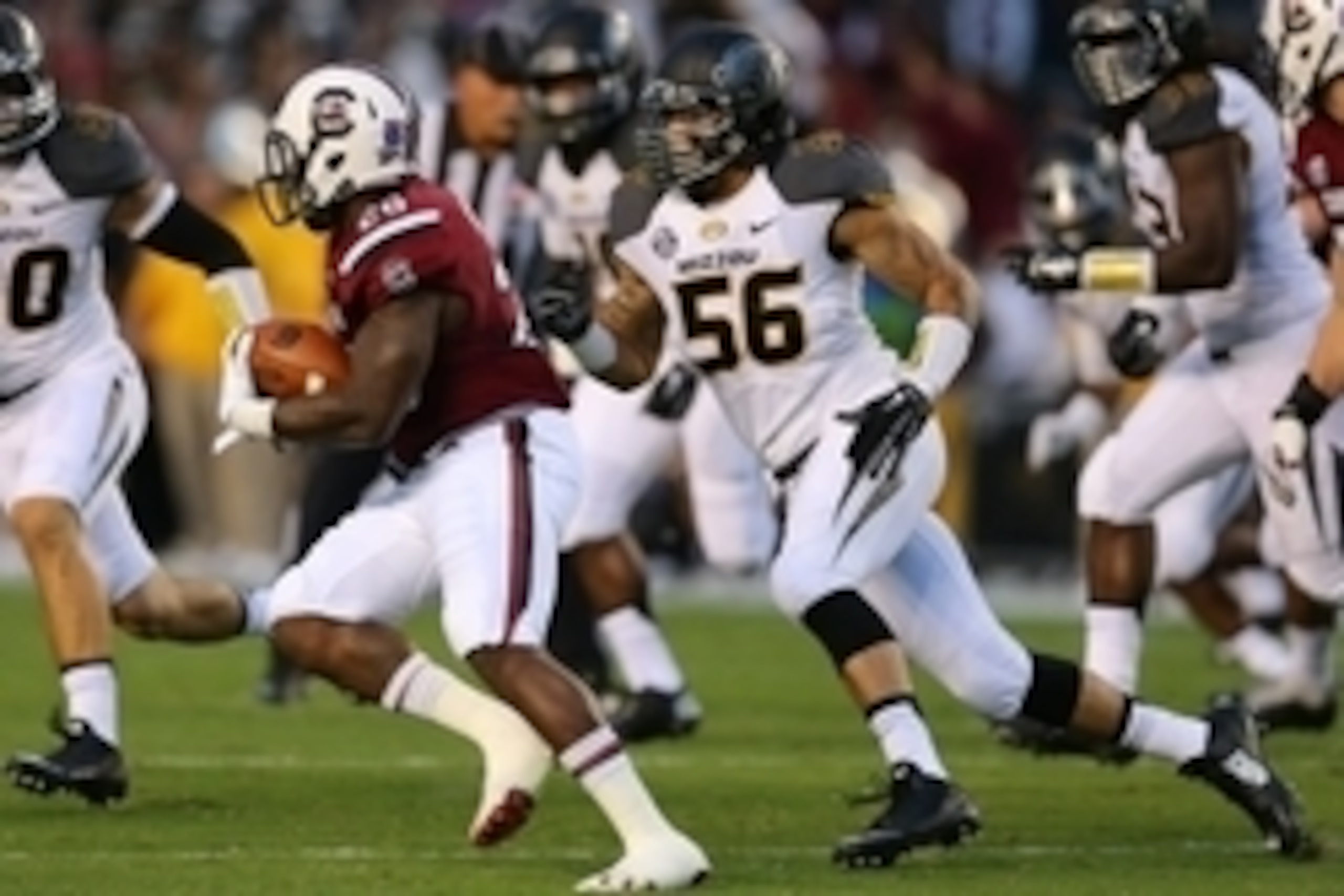 Sep 27, 2014; Columbia, SC, USA;  Missouri Tigers defensive lineman Shane Ray (56) gives chase to South Carolina Gamecocks running back Mike Davis (28) during the first quarter at Williams-Brice Stadium. Missouri wins in the final minutes 21-20 over South