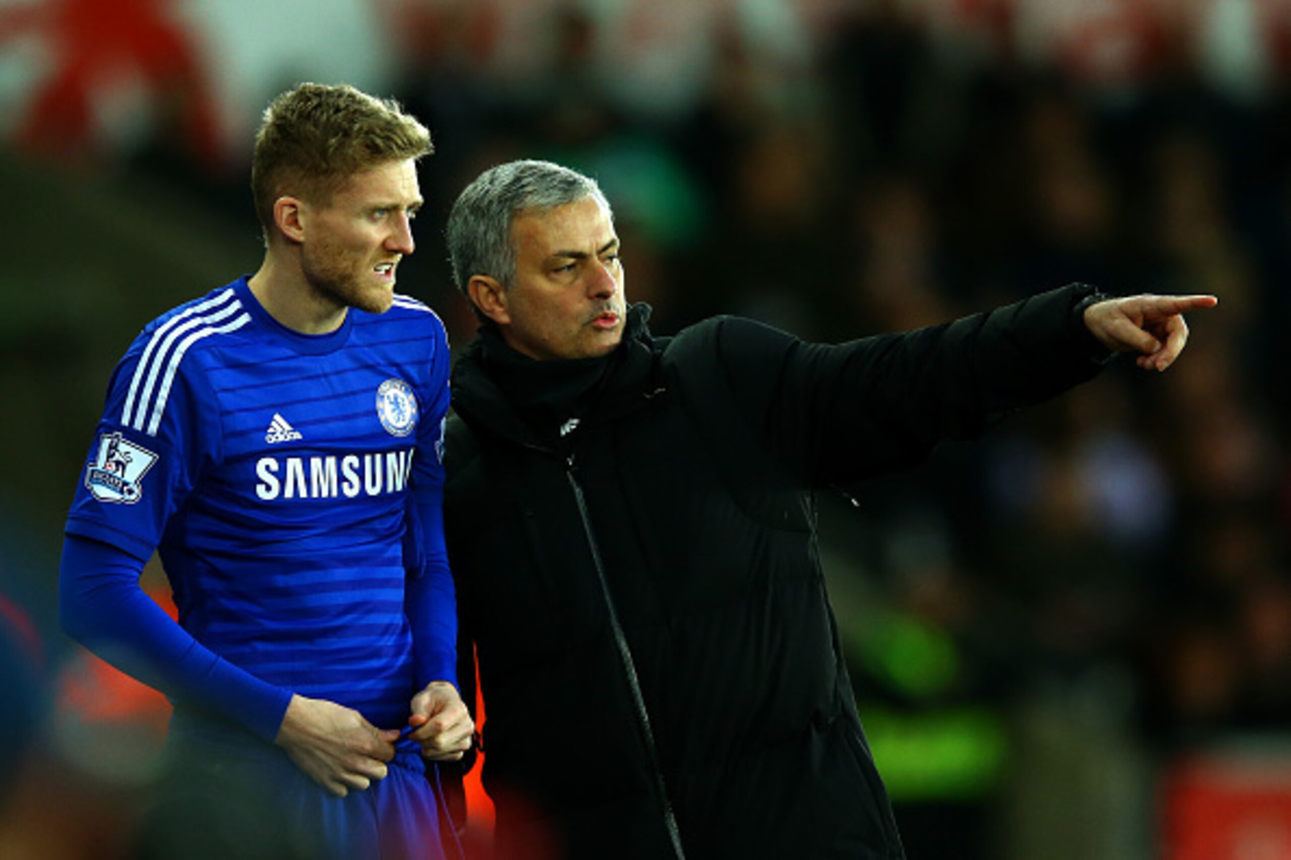 SWANSEA, WALES - JANUARY 17:  Jose Mourinho, manager of Chelsea speaks with Andre Schuerrle of Chelsea as he prepares to gon on during the Barclays Premier League match between Swansea City and Chelsea at Liberty Stadium on January 17, 2015 in Swansea, Wa
