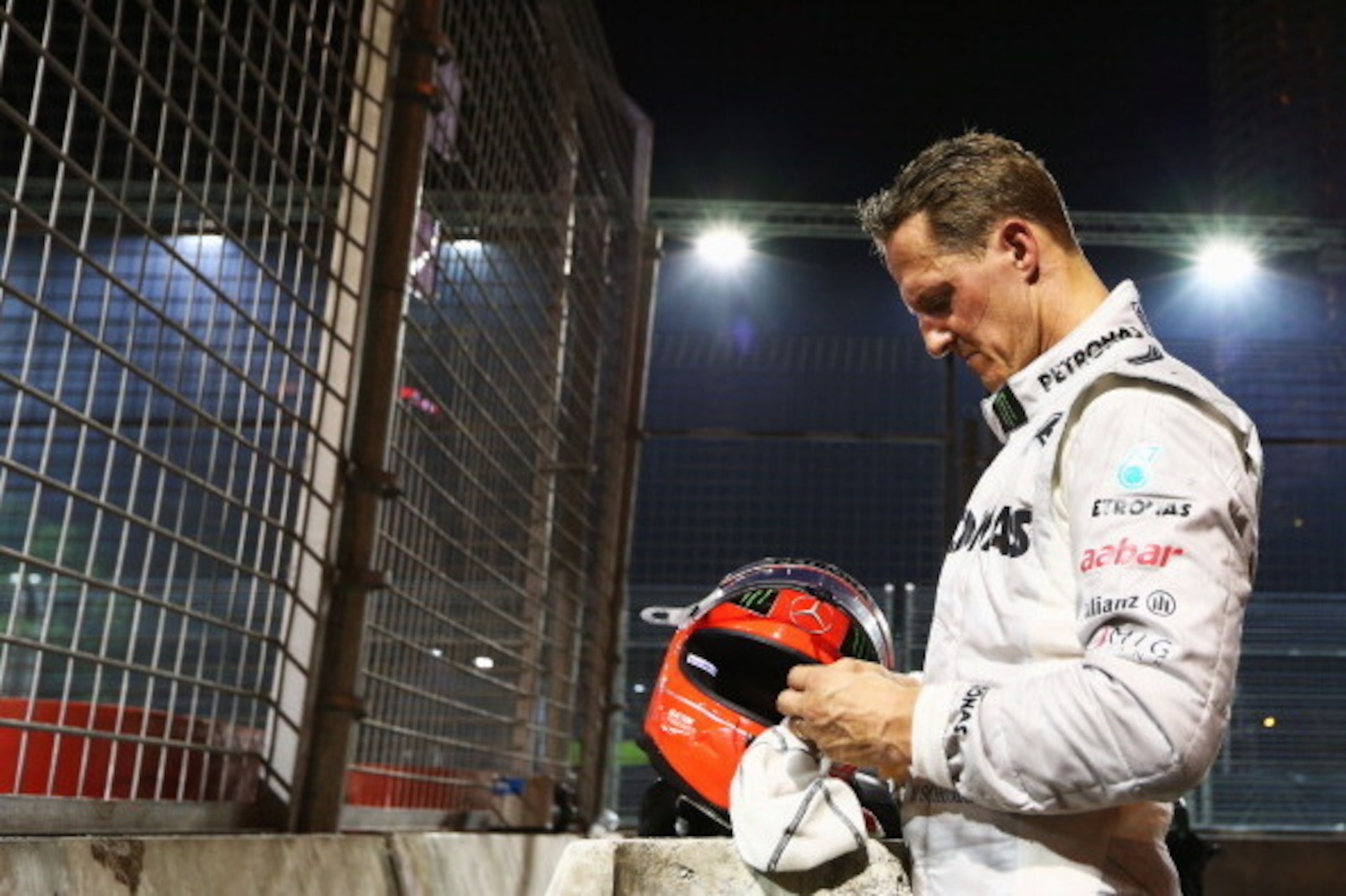 SINGAPORE - SEPTEMBER 23:  Michael Schumacher of Germany and Mercedes GP retires early after crashing into the back of Jean-Eric Vergne of France and Scuderia Toro Rosso during the Singapore Formula One Grand Prix at the Marina Bay Street Circuit on Septe
