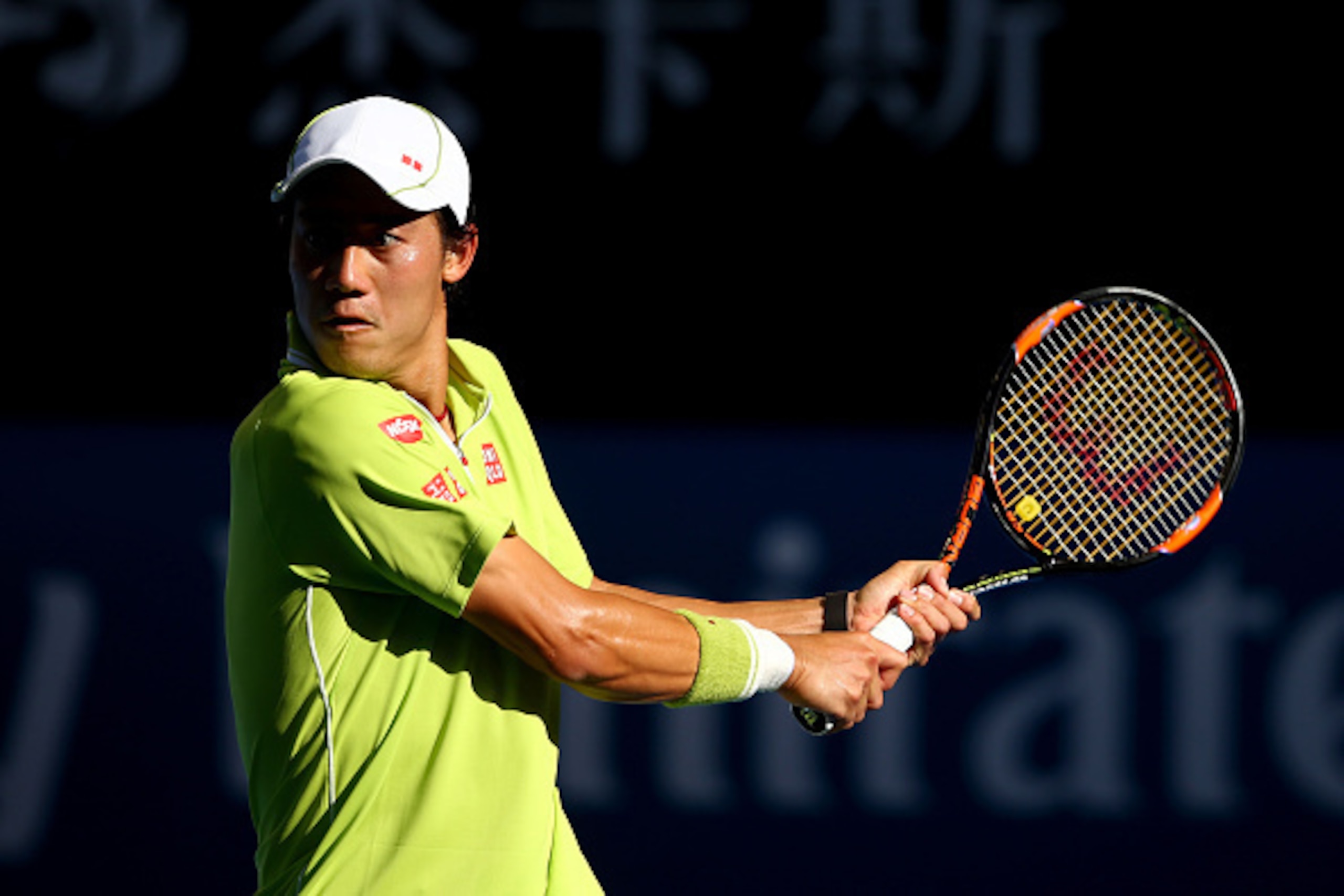 MELBOURNE, AUSTRALIA - JANUARY 26:  Kei Nishikori of Japan plays a backhand in his fourth round match against David Ferrer of Spain during day eight of the 2015 Australian Open at Melbourne Park on January 26, 2015 in Melbourne, Australia.  (Photo by Cliv