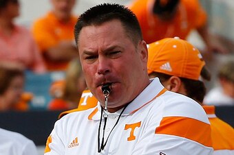 JACKSONVILLE, FL - JANUARY 02:  Head coach Butch Jones of the Tennessee Volunteers watches his team warmup before the TaxSlayer Bowl against the Iowa Hawkeyes at EverBank Field on January 2, 2015 in Jacksonville, Florida.  (Photo by Sam Greenwood/Getty Im