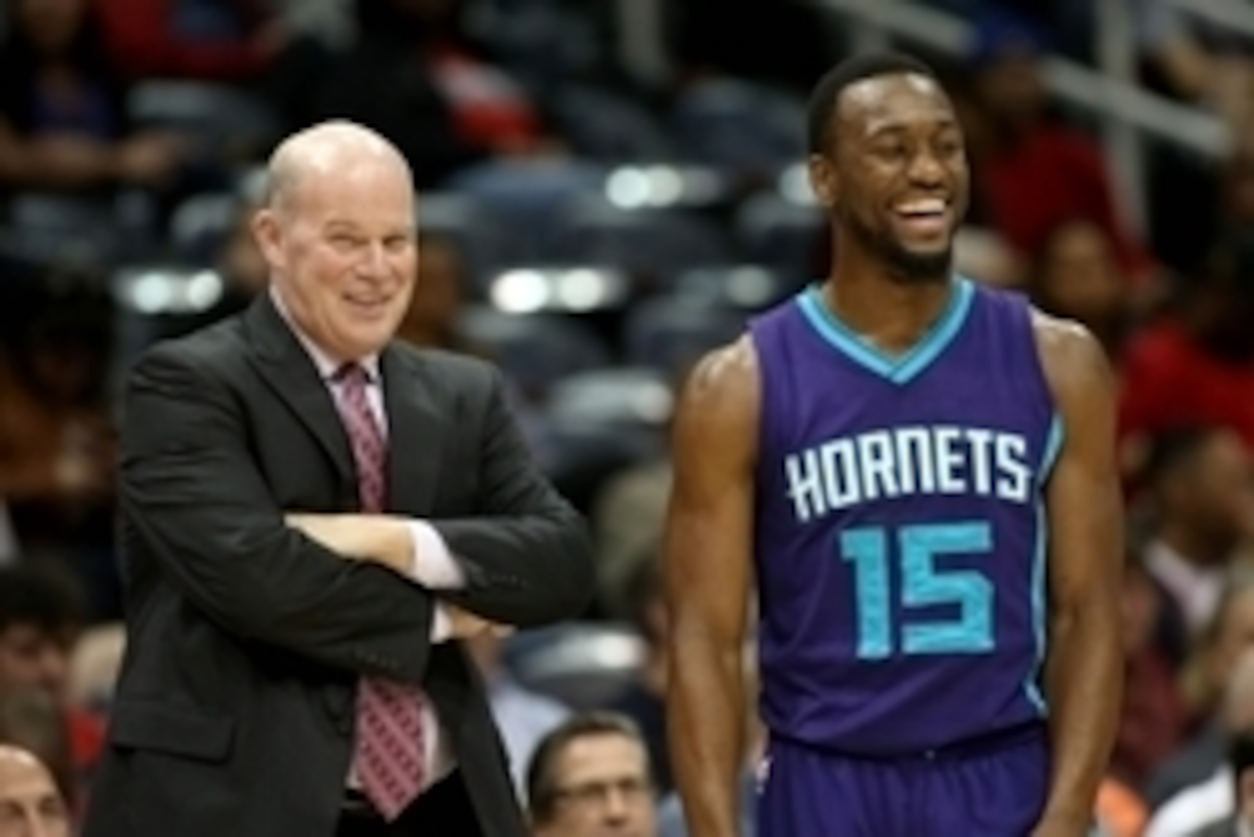 Oct 20, 2014; Atlanta, GA, USA; Charlotte Hornets head coach Steve Clifford talks with guard Kemba Walker (15) during a time out in their game against the Atlanta Hawks at Philips Arena. Mandatory Credit: Jason Getz-USA TODAY Sports