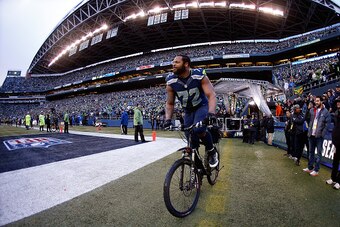SEATTLE, WA - JANUARY 18:  Michael Bennett #72 of the Seattle Seahawks rides a police bike after the Seahawks 28-22 overtime victory against the Green Bay Packers during the 2015 NFC Championship game at CenturyLink Field on January 18, 2015 in Seattle, W