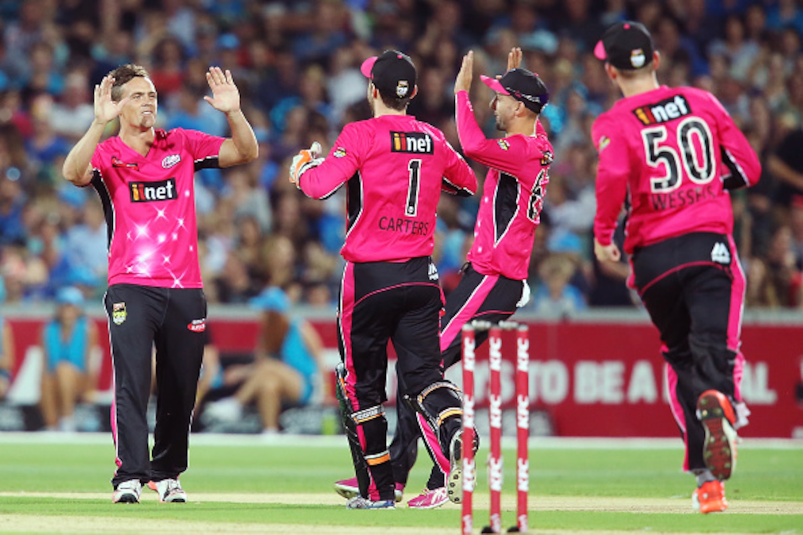 ADELAIDE, AUSTRALIA - JANUARY 24: Stephen O'Keefe of the Sydney Sixers celebrates with teammates after he got the wicket of Tim Ludeman of the Adelaide Strikers during the Big Bash League Semi FInal match between the Adelaide Strikers and the Sydney Sixer