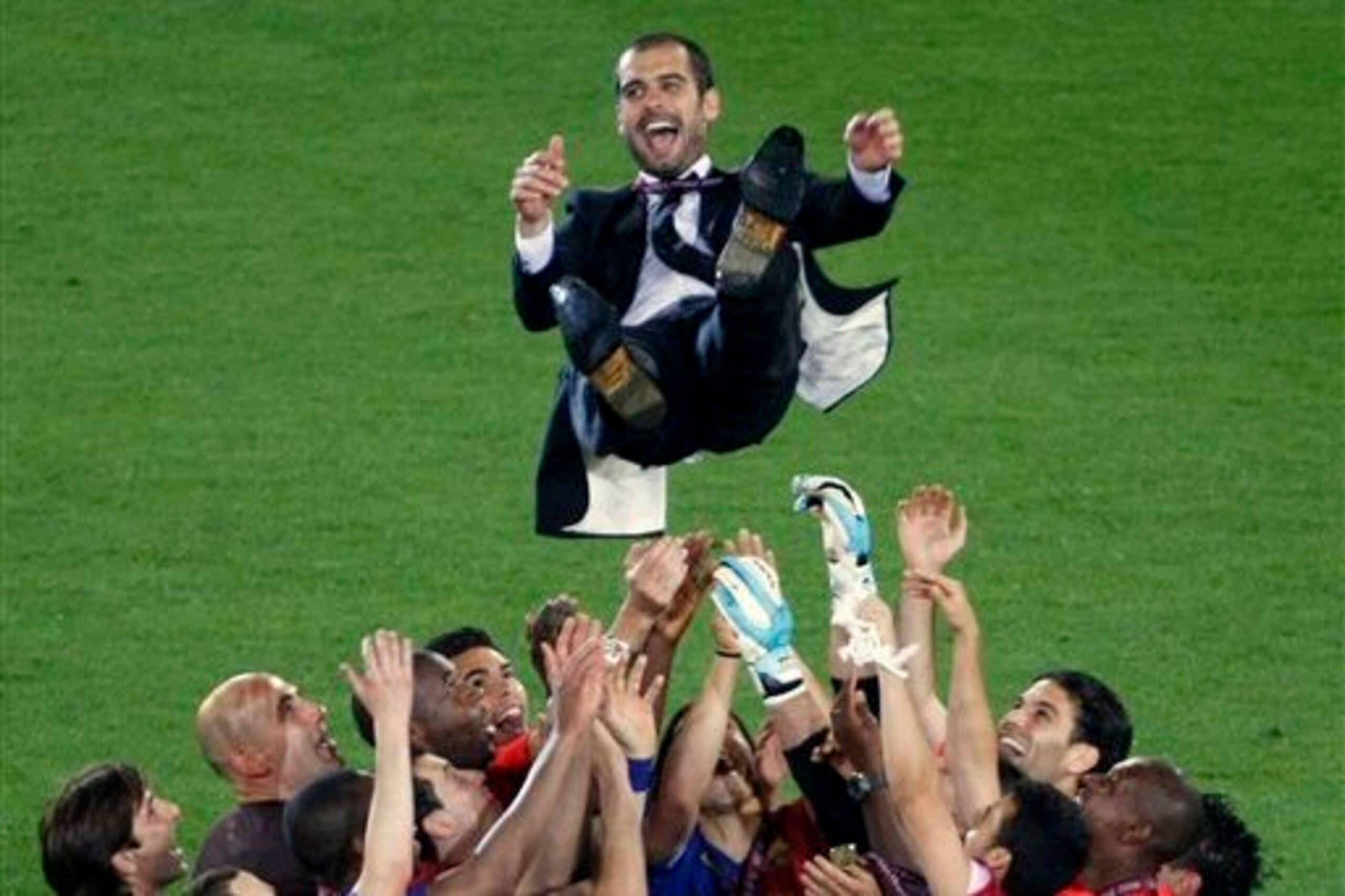 Guardiola's players throw him in the air after winning the Champions League in 2009.